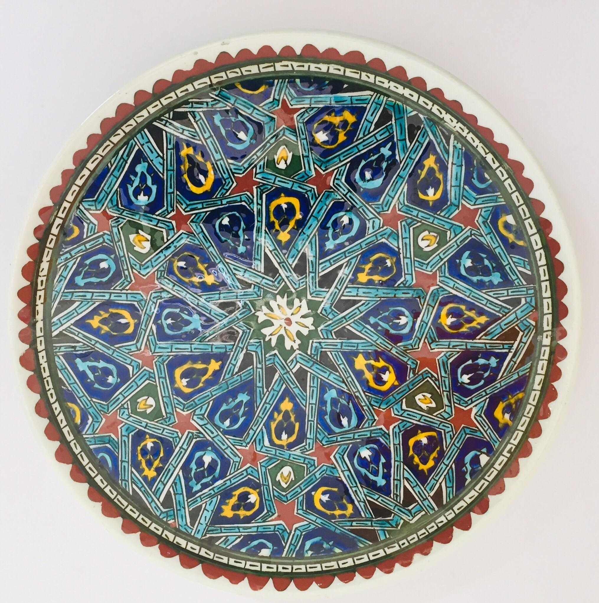 Polychrome hand painted and handcrafted ceramic wall decorative plate with polychrome Ottoman floral design.
This is an intricately, hand painted Moorish plate that was made in Turkey.
Turkey is famous for its kiln products, such as tiles and