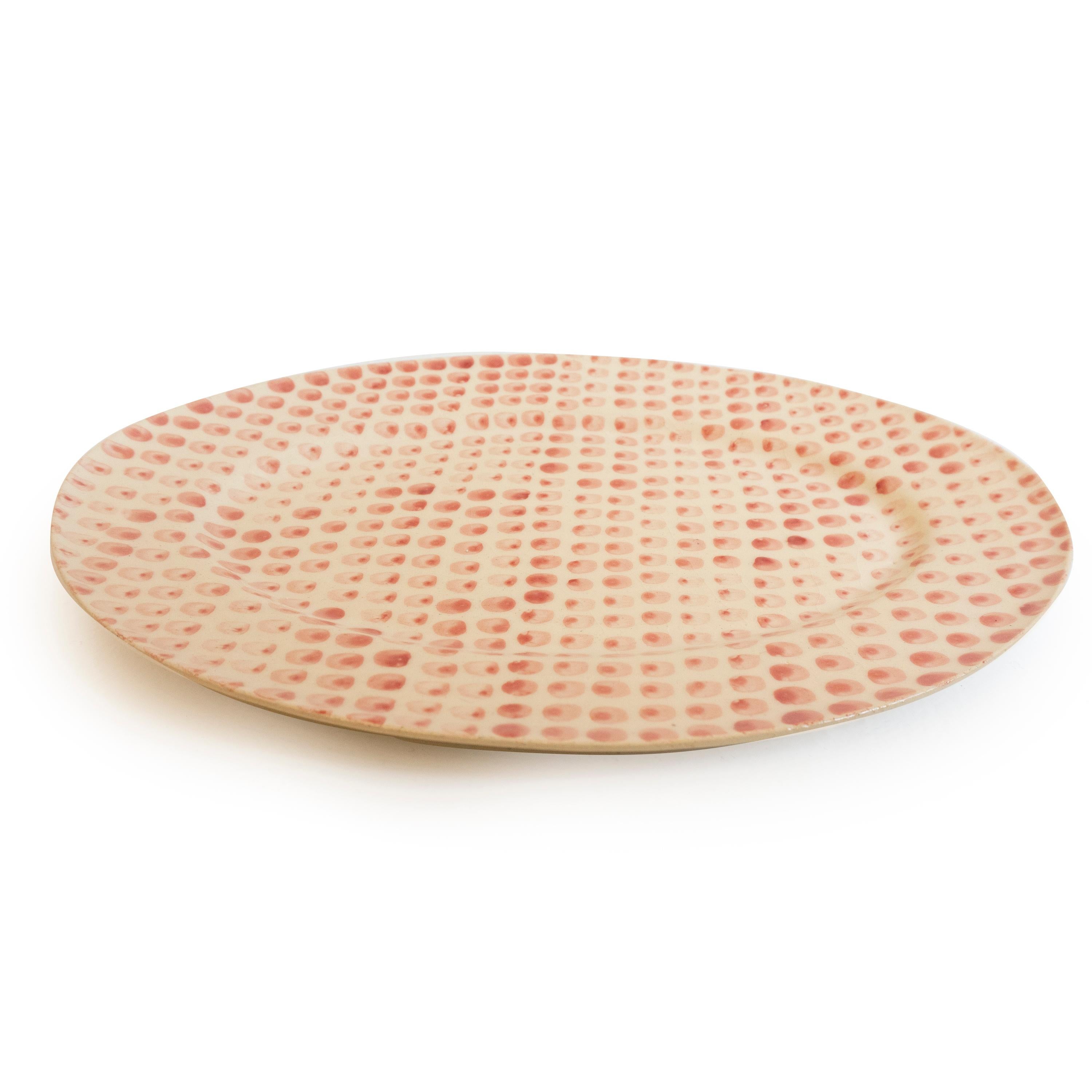 This handcrafted platter is handmade in Paris, France. From the hand beating of the clay to the drawn illustration each platter is meticulously crafted. This platter is made from natural clay resulting in slightly different hues from one piece to