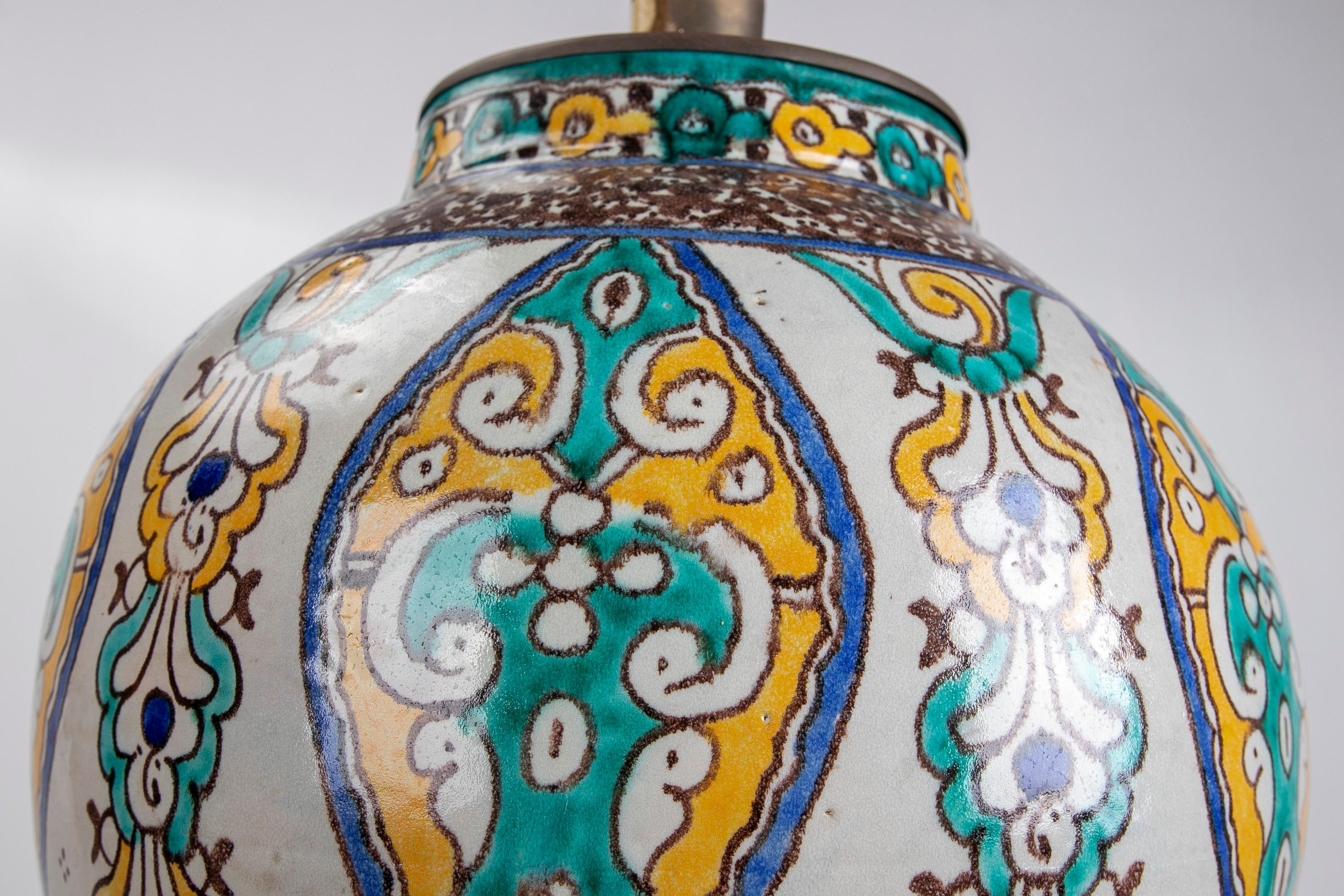 Hand-Painted ceramic table lamp with metal decorations.