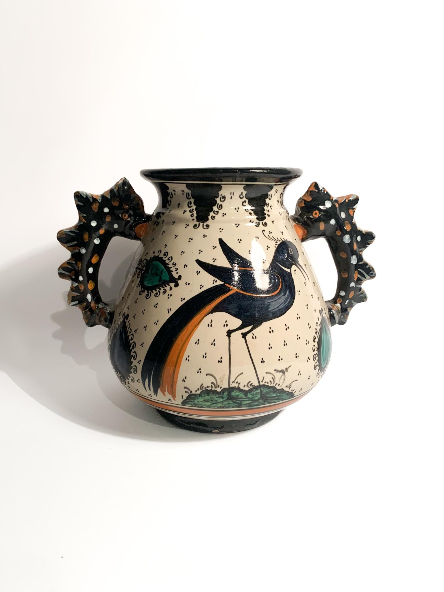 Hand-painted ceramic vase, made by Molaroni Pesaro in the 1950s. The vase has some small chips, as shown in the pictures. 

Ø cm 23 h cm 17

Since 1880, the Ceramiche Molaroni factory, founded in Pesaro, has been producing hand-made furnishing