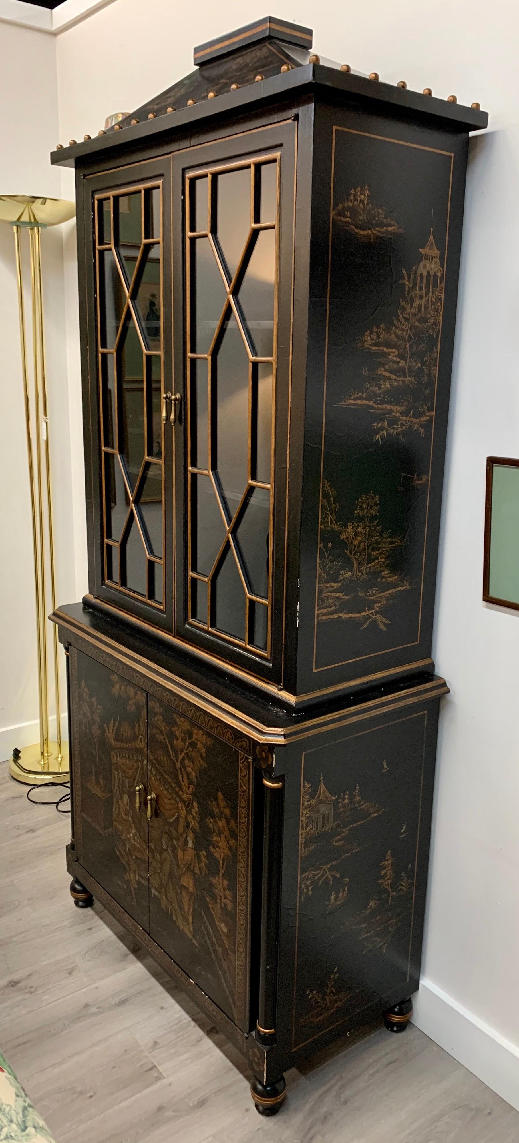Stunning Chinese Export chinoiserie cabinet with detailed fretwork over glass at top. Features rare
pagoda shaped top. Multiple shelves with plenty of storage. Now, more than ever, home is where the heart is.