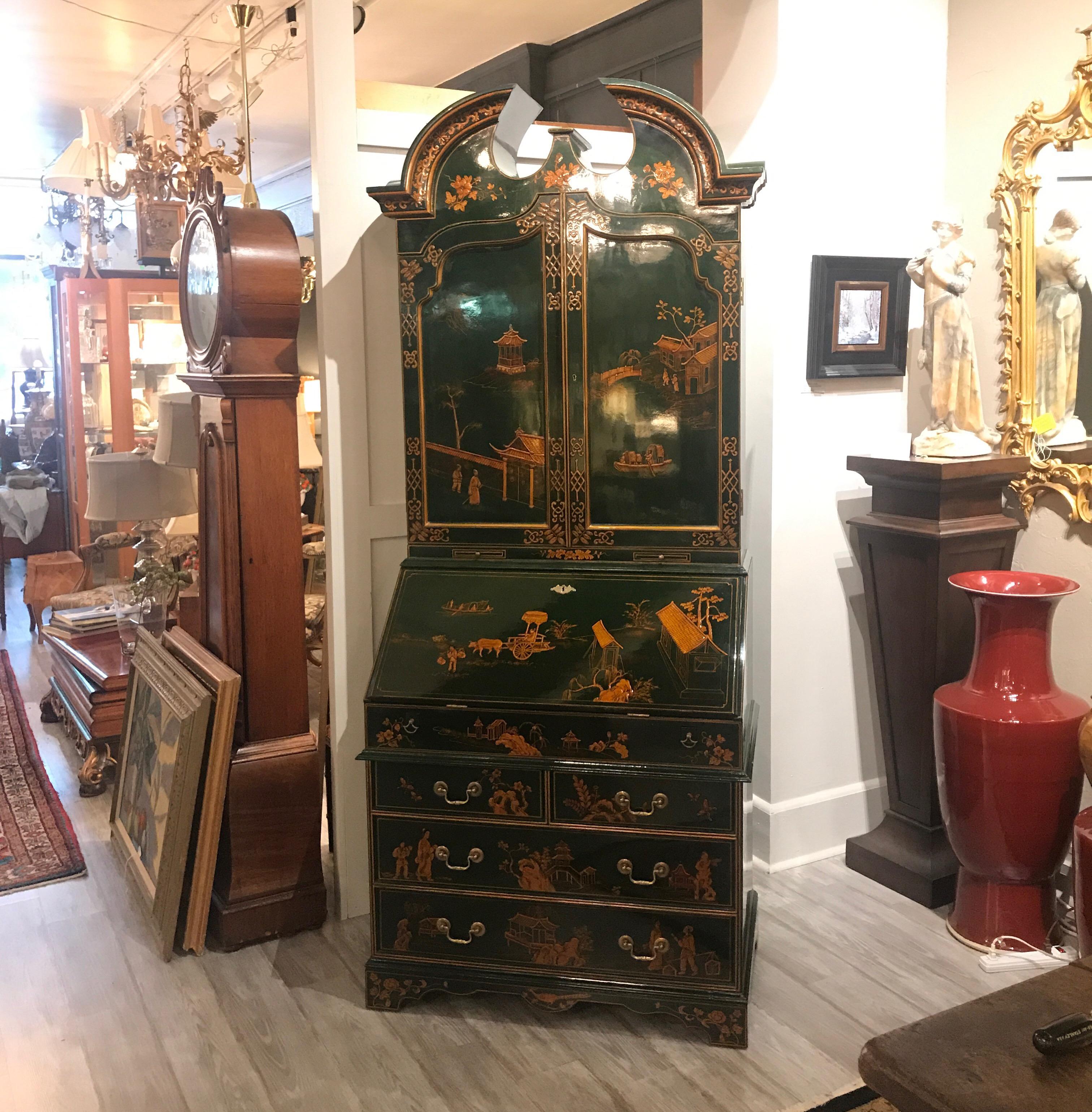 Fabulous lacquered chinoiserie secretary made for Maitland Smith. The interior has many individual drawers and compartments. A drop front desk reveals more drawers. The emerald green lacquered cabinet with hand painted Chinoiserie decoration is a