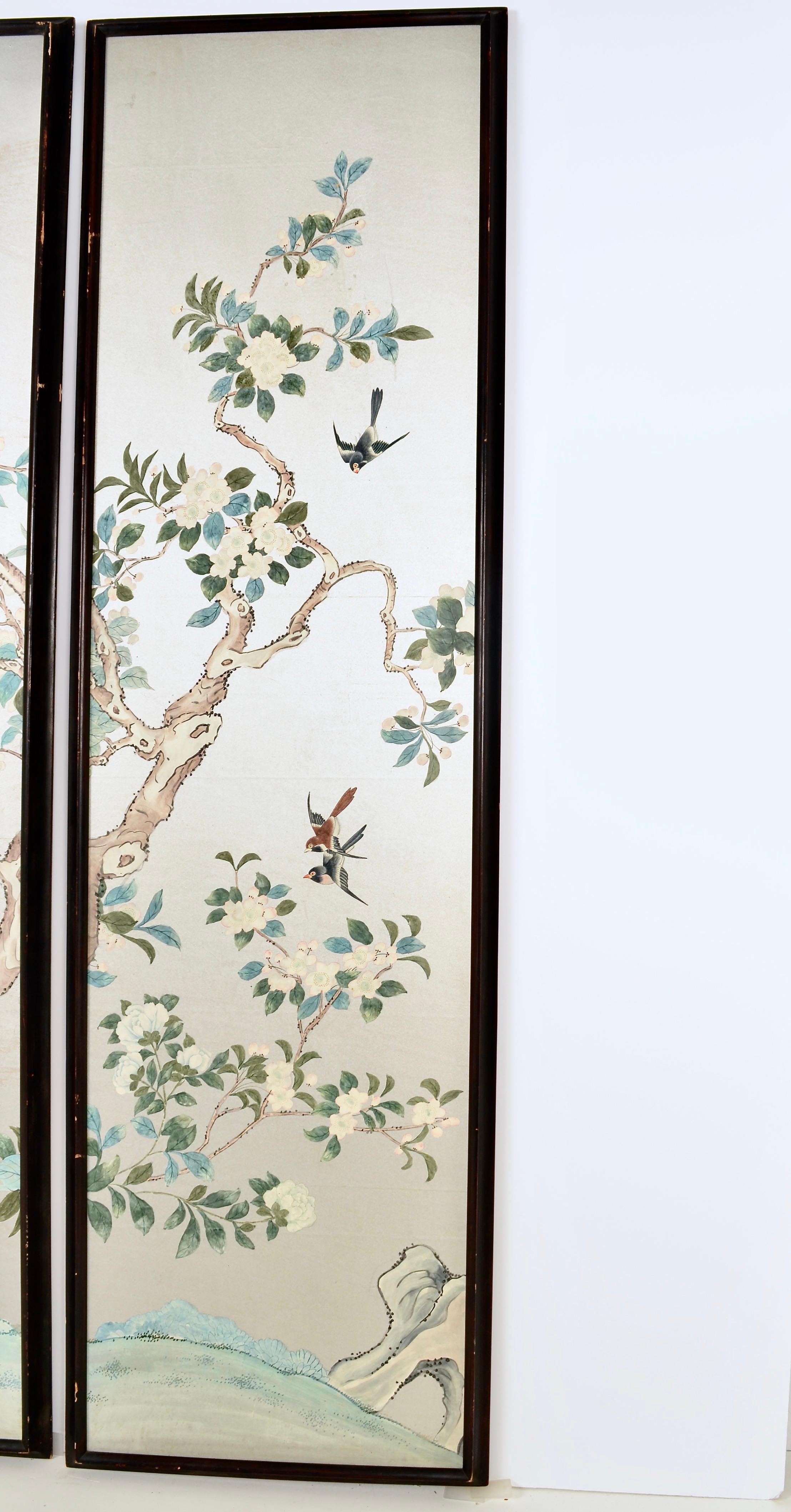 A set of three hand painted silver wallpaper panels, individually framed. The hand painting is lovely and expertly executed, featuring a classical Chinese motif of birds and flowers. Color remains vibrant and clear. The frames are original with an