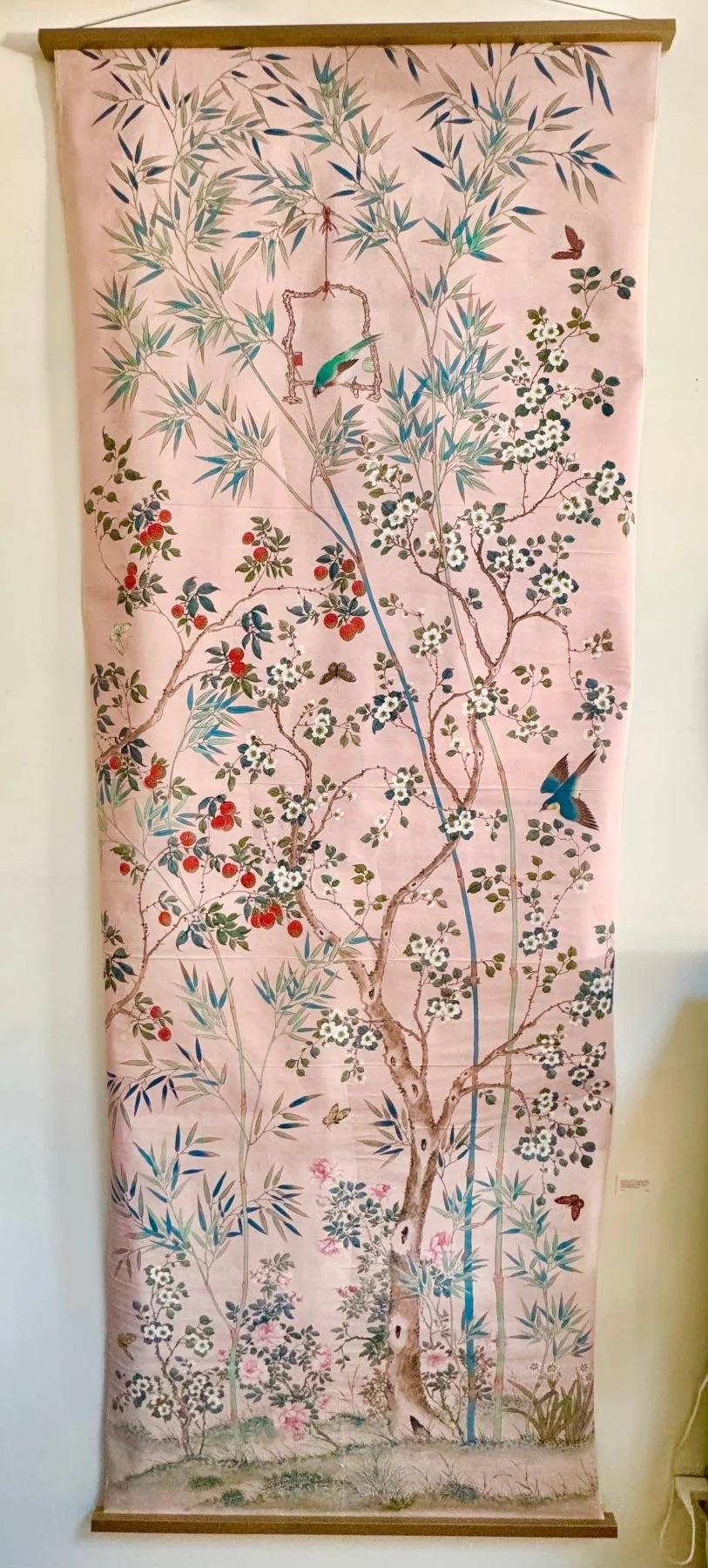 Early 20th Century pink background wallpaper panel having flowers, vines, and birds.  Likely Gracie.  The paper pane mounted on canvas with gilt hanging clamps.  132” h. x 48” w. (Can be shortened if necessary)

