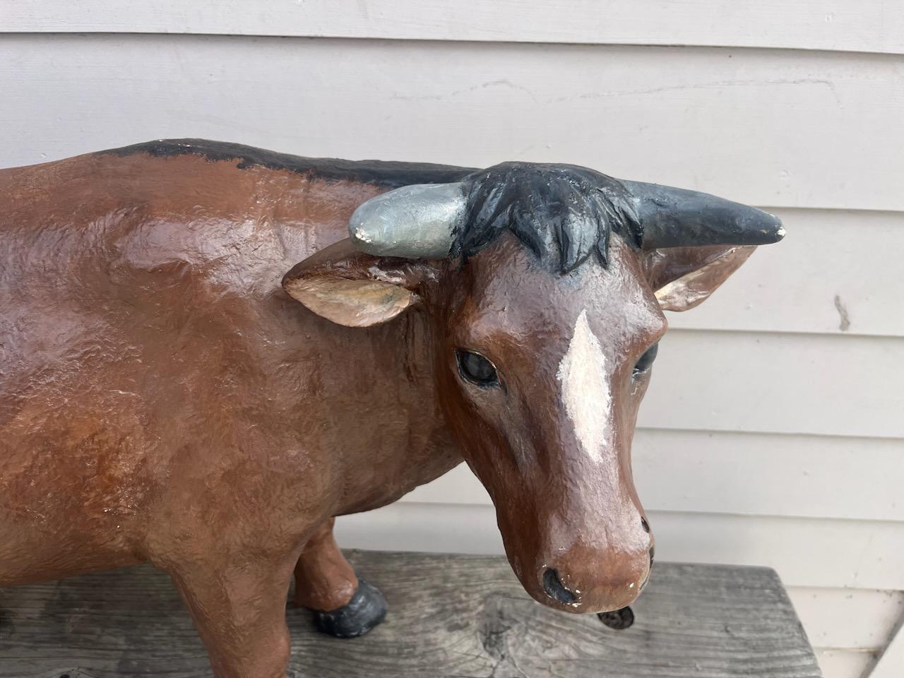 This fun and folky cow was found on a dairy farm probably used as a advertising prop. or trade sign.It is hand painted pot metal and in very good condition.