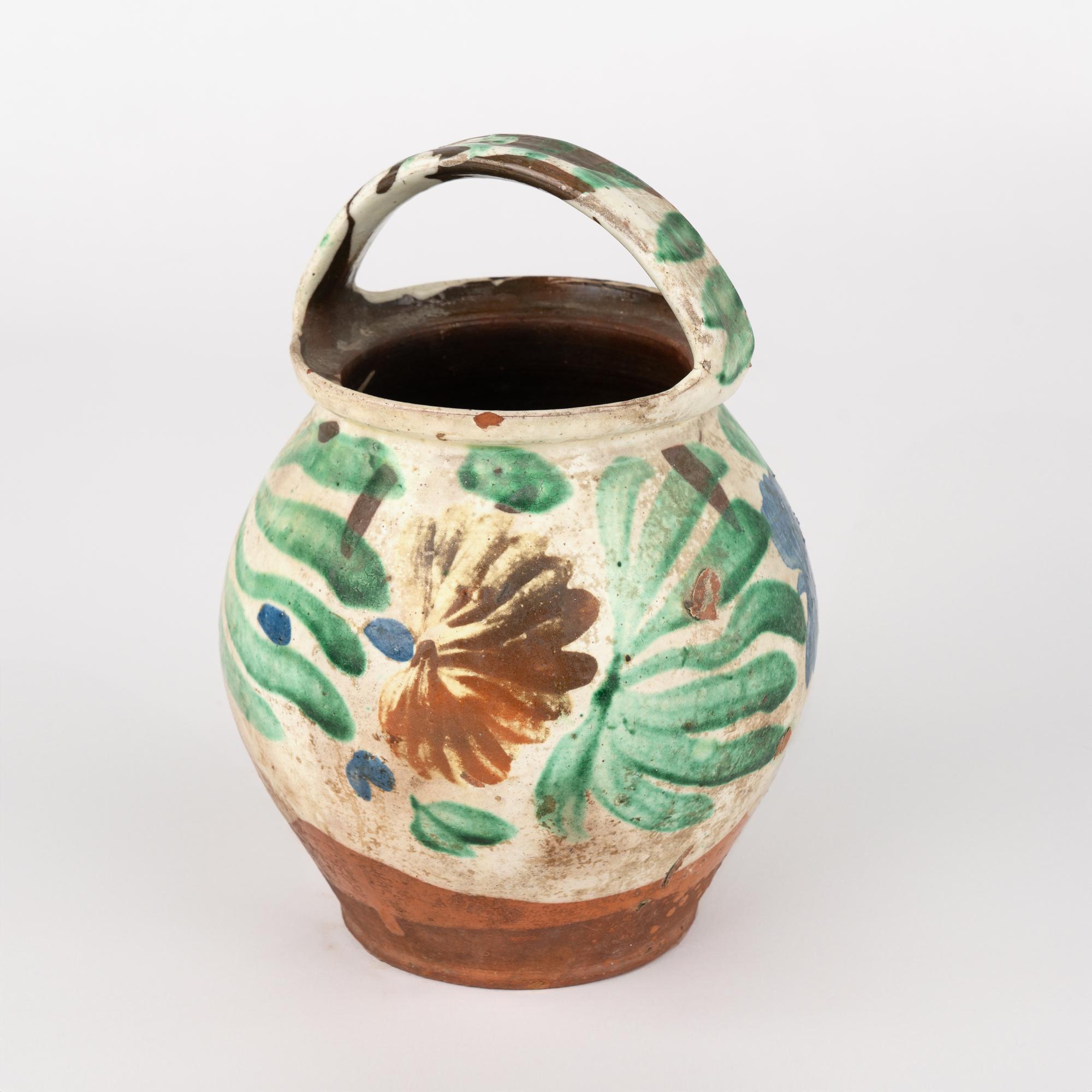 Original hand painted earthenware pottery with handle.
Sold in original vintage used condition. Any chips, cracks, distress to paint or pottery is reflective of age and use. Solid condition.

With over 37 years of experience selling European