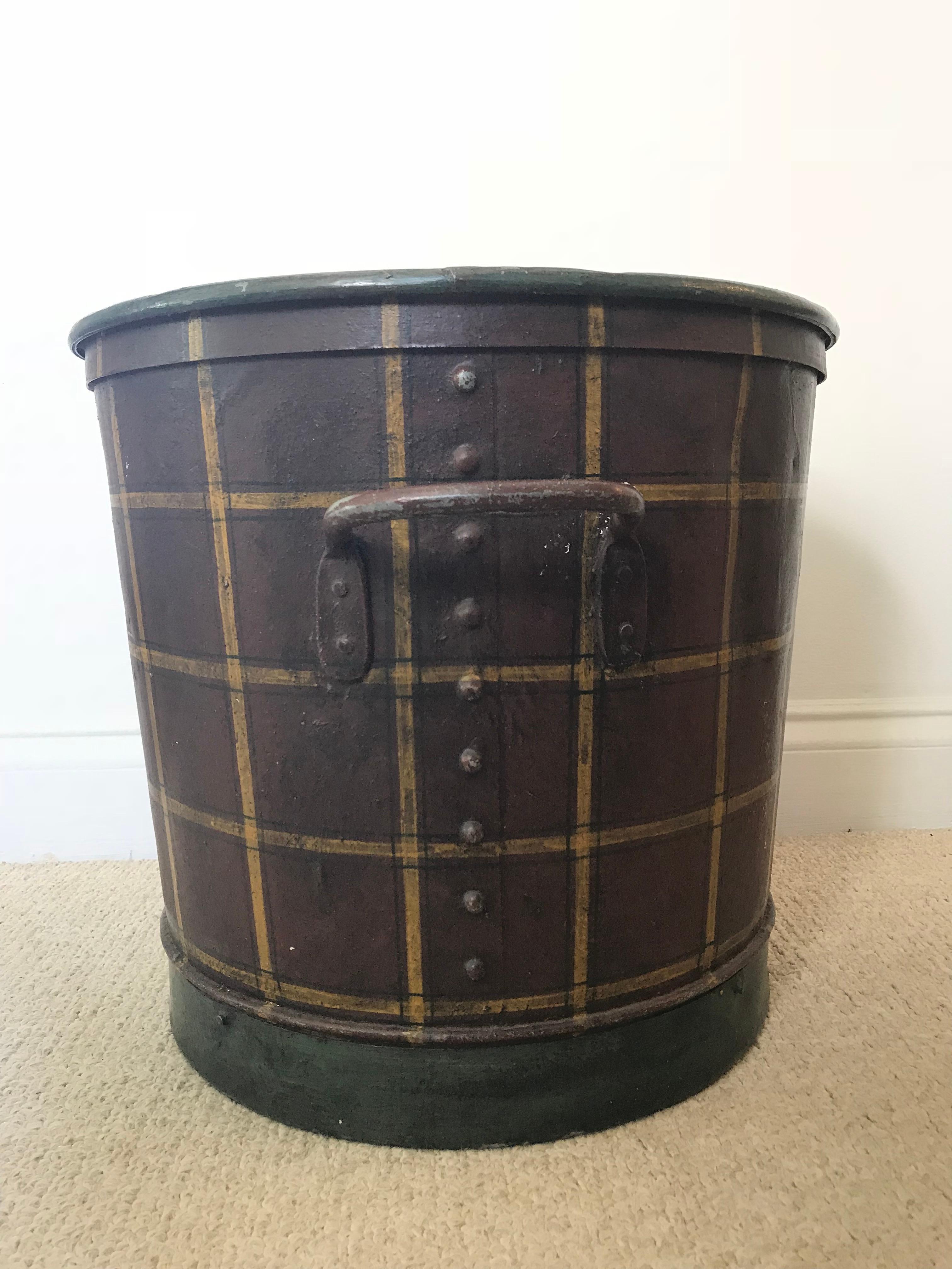 Love plaids? A simple tin bucket became a lovely accessory/log holder when it was painted a plaid pattern on the outside and a deep, dark green on the outside. The shades of burgundy, green and mustard work well together, and the seams are covered