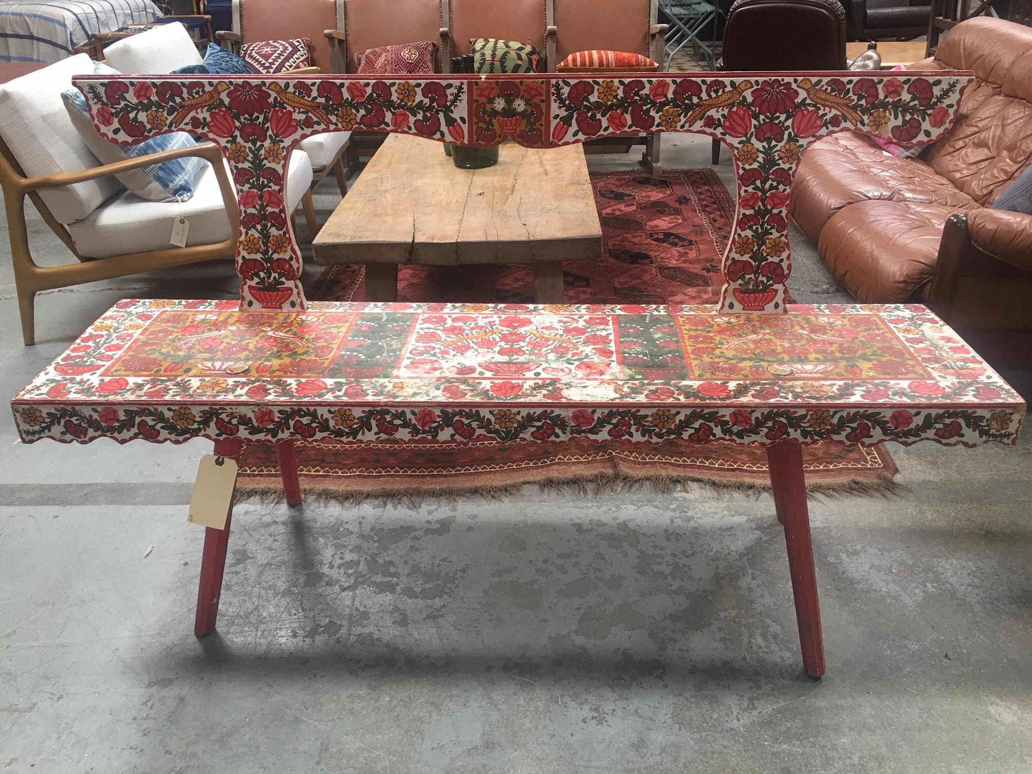 This vintage bench is visually striking and totally one-of-a-kind. The hand painted floral scenes are still in tact and make this a really fun and cheery piece.