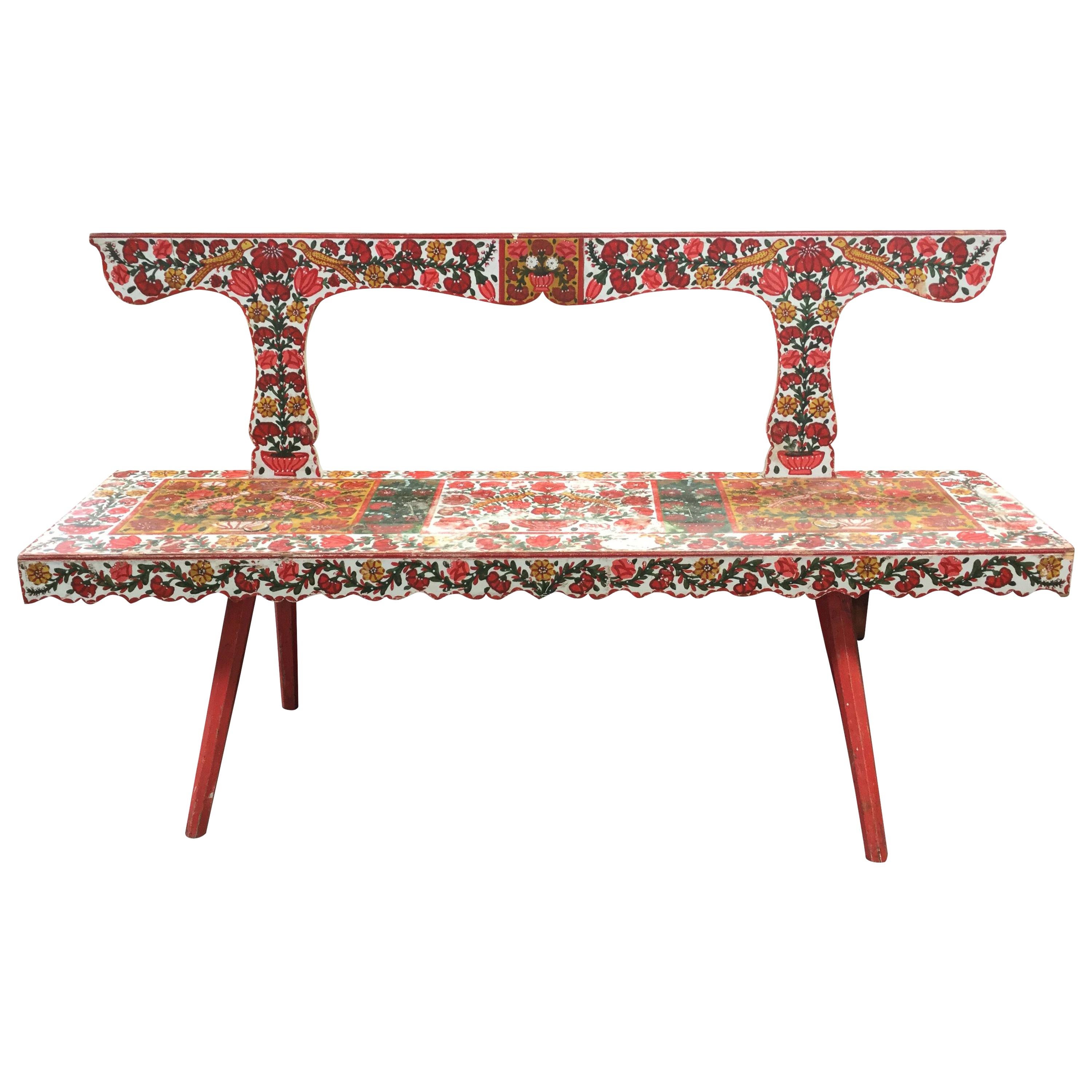 This vintage bench is visually striking and totally one-of-a-kind. The hand painted floral scenes are still in tact and make this a really fun and cheery piece.