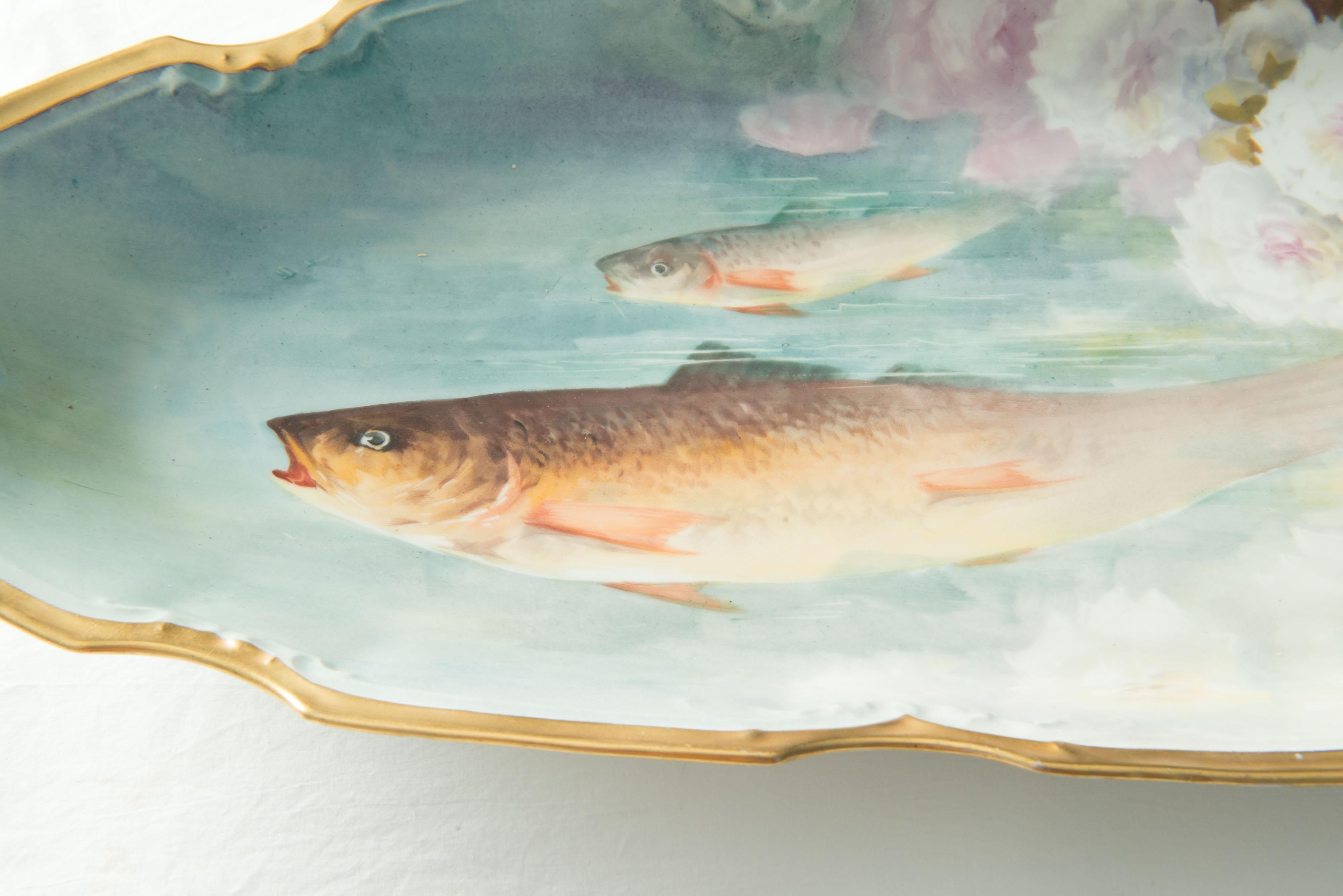 A French Limoges porcelain fish set by Flambeau with 12 dinner plates 9.5