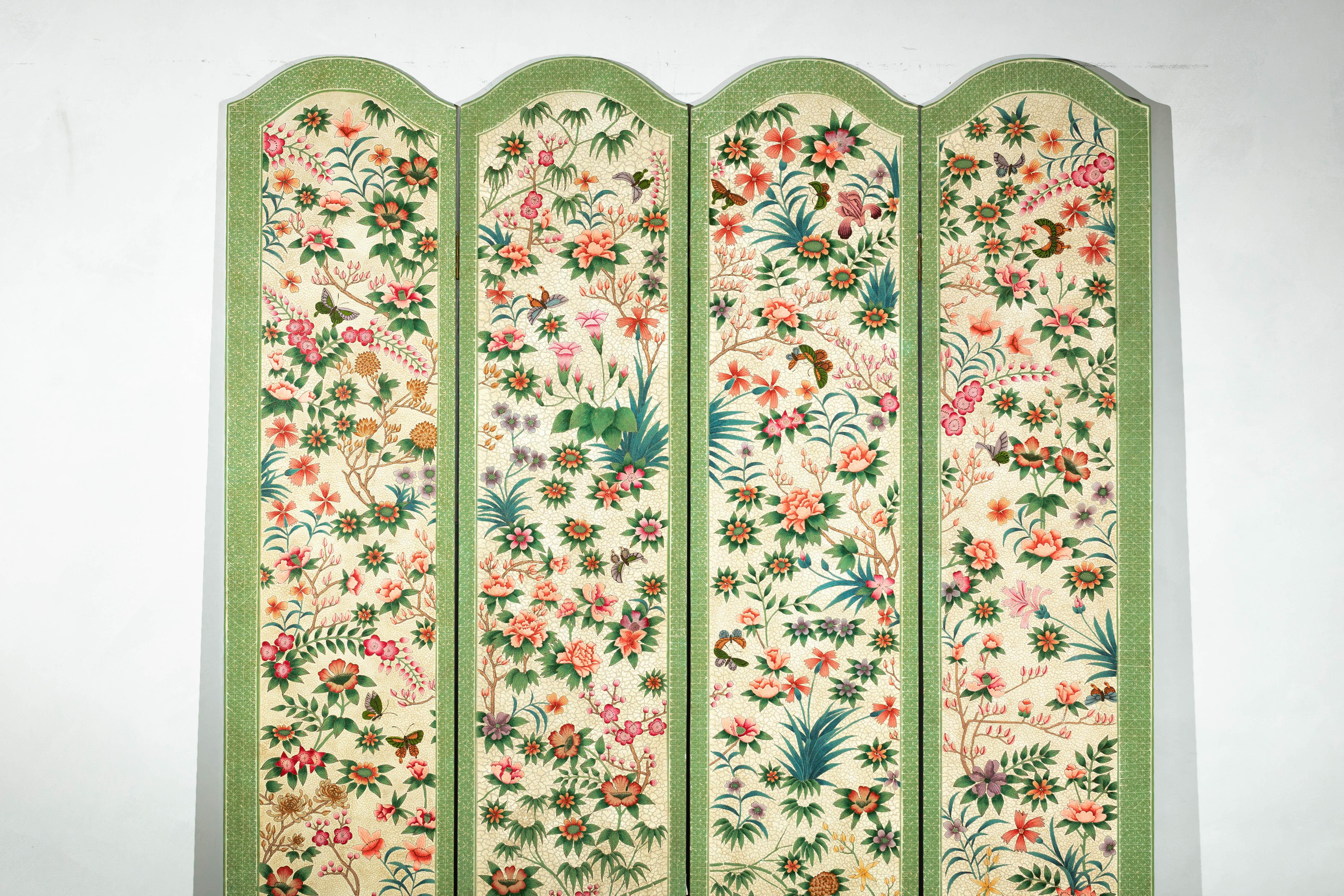 A vintage four-panel hand-painted screen with butterfly and flower motifs. A celebration of artistry and nature, this vintage Chinese four-panel screen brings elegance to any space with its vibrant hand-painted floral and butterfly motifs. The