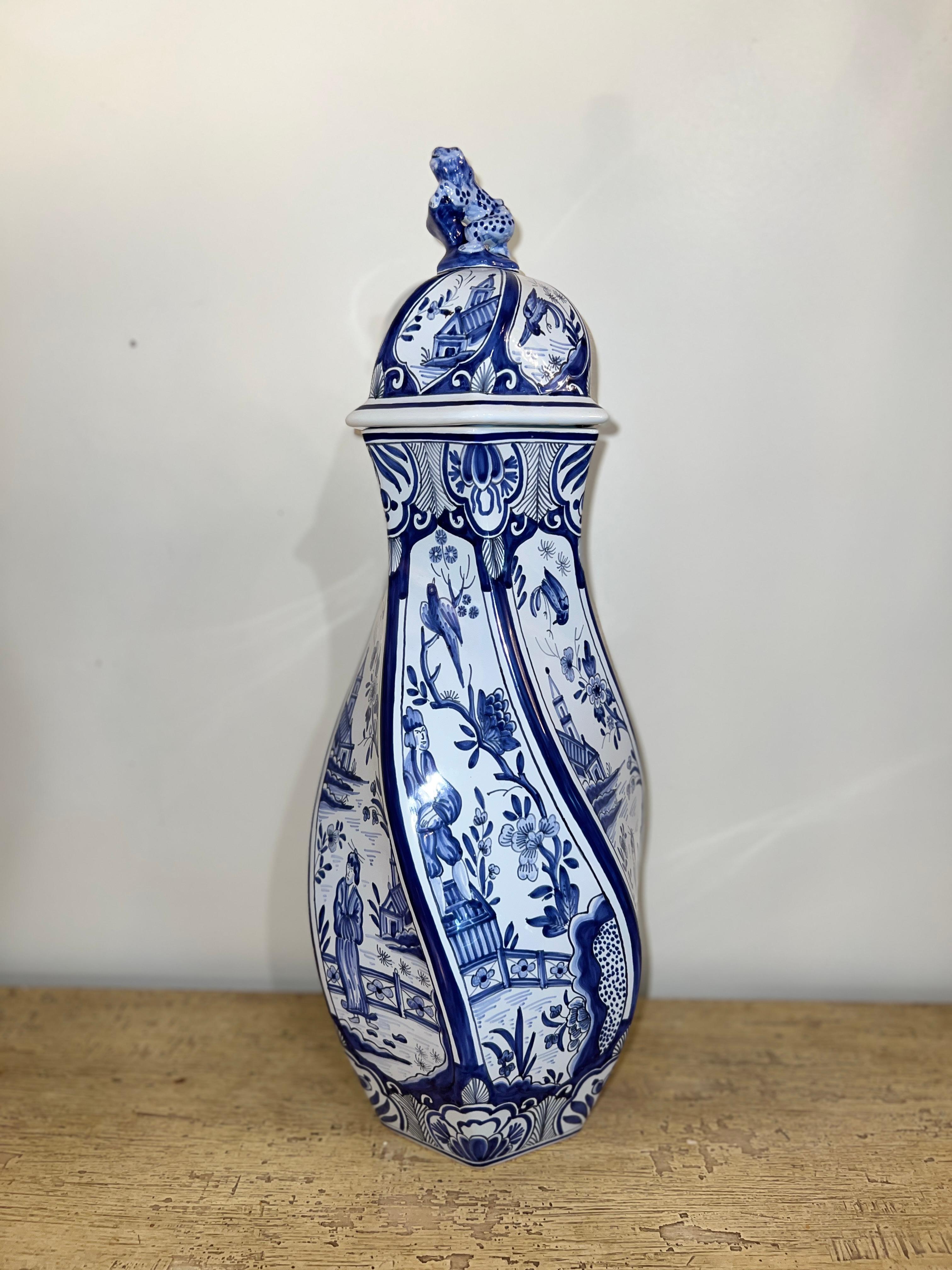 A hand-painted French blue and white lidded vase, signed for Tiffany & Co, featuring exquisite porcelain craftsmanship. 