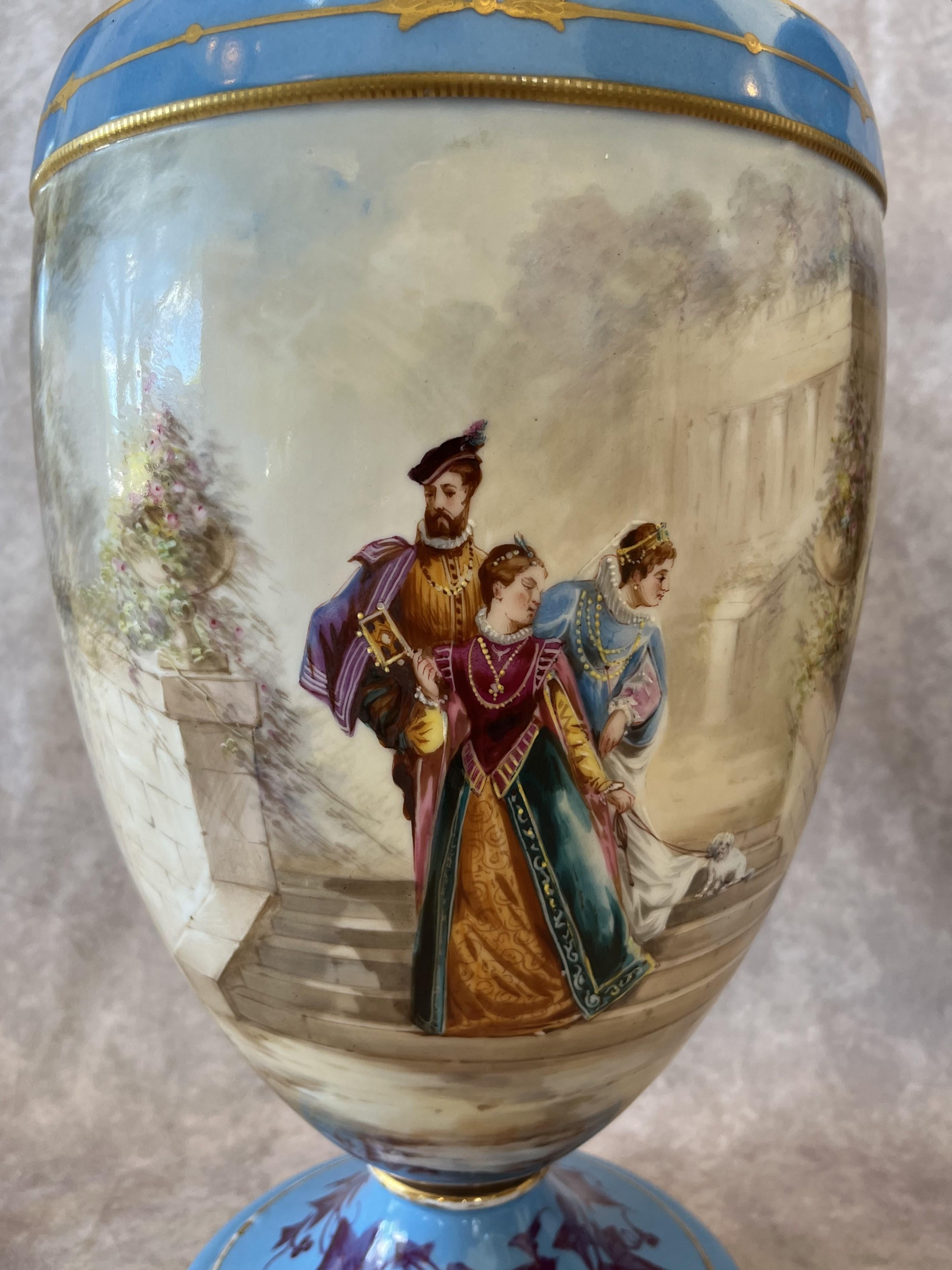 In the style of the manufacture the Sevres, lovely pair of porcelain vases with hand painted scenes on a light blue background.