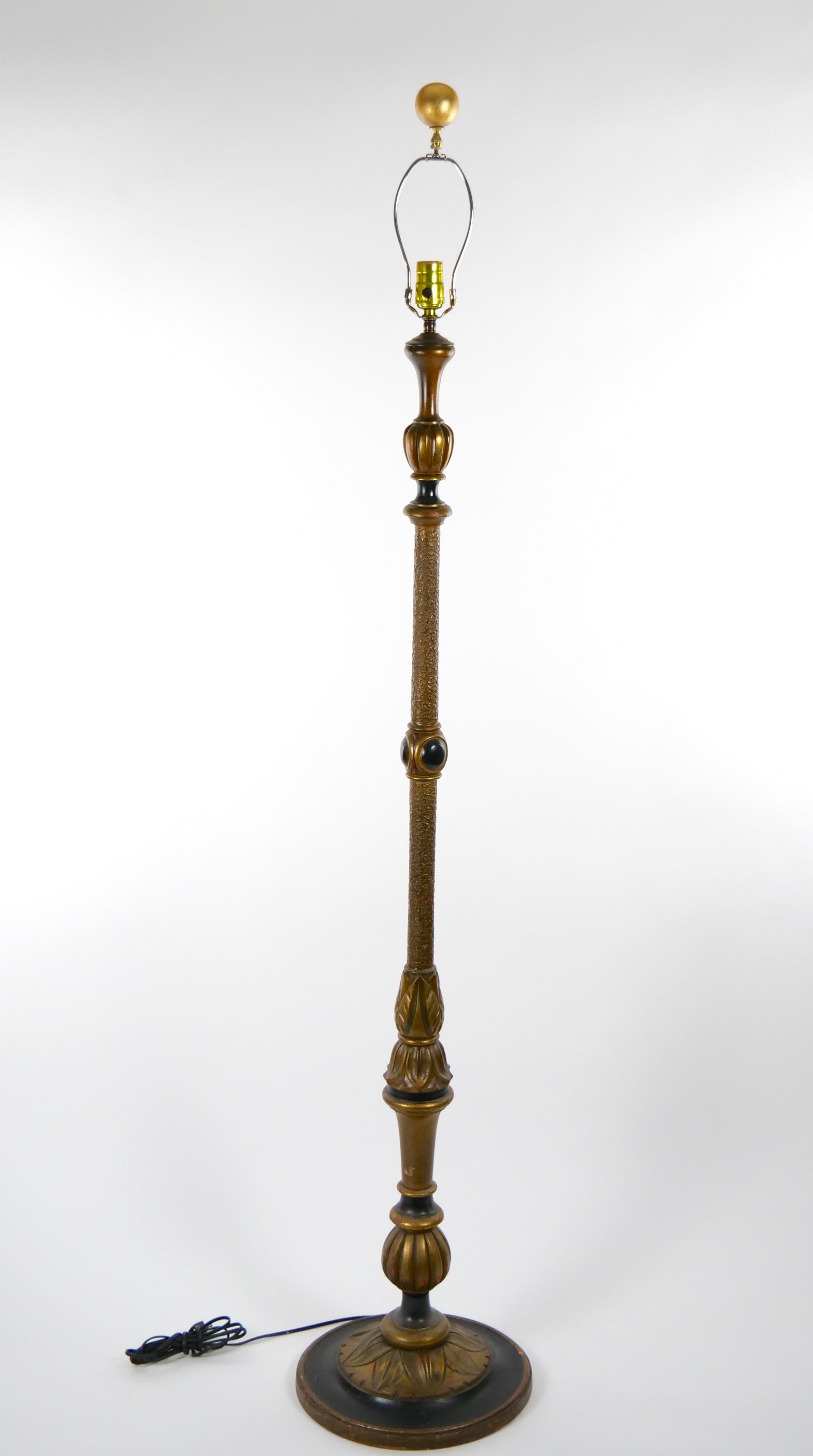 Introducing our opulent gilt wood floor lamp, a true masterpiece of craftsmanship. Each element, from the meticulously hand-painted details to the intricately turned and hand carved wooden frame and base, showcases the utmost attention to detail.