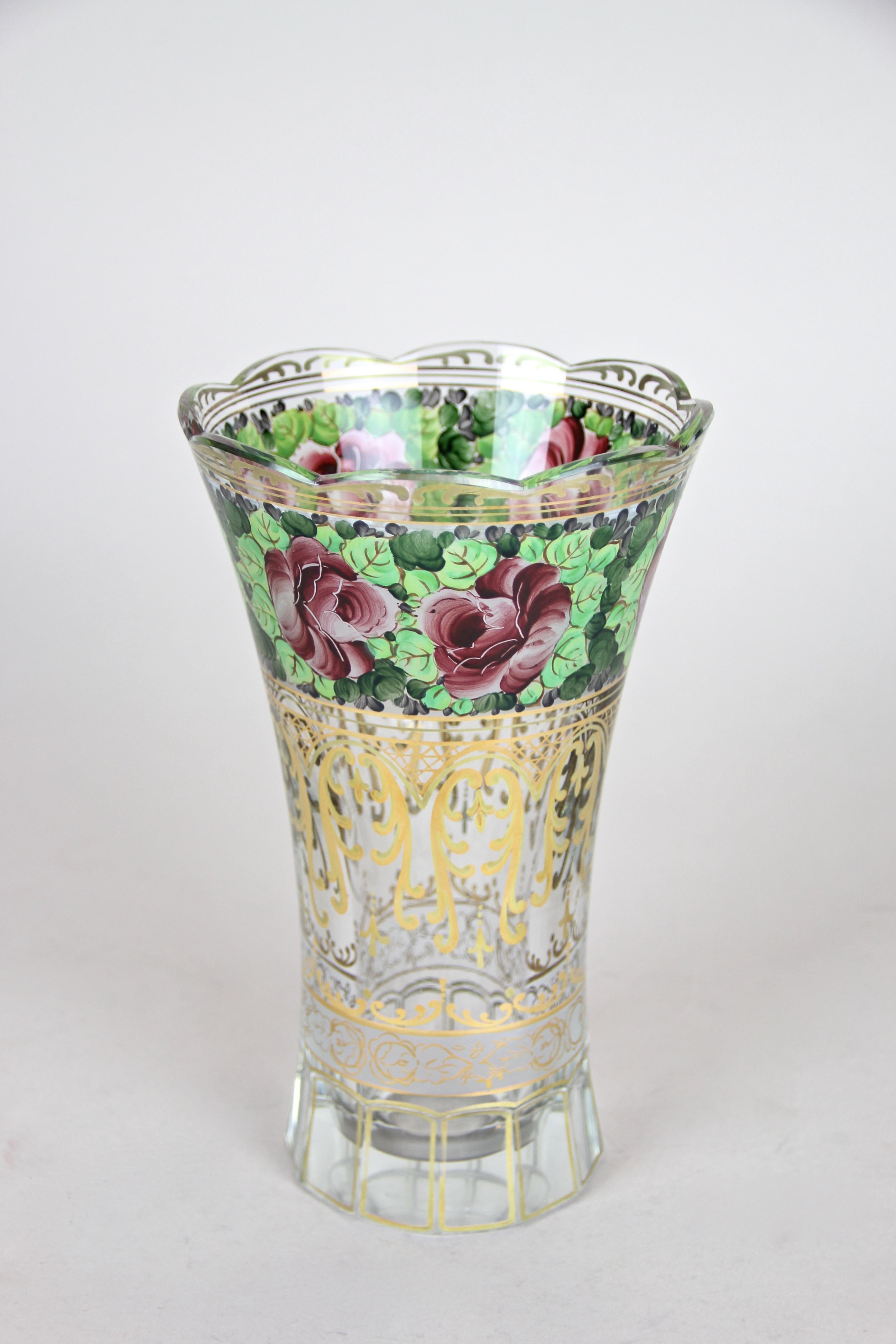 Very decorative hand painted glass vase from the 20th century in Austria. Processed in the late Art Nouveau period circa 1920, this great looking vase is adorned by artfully hand painted flowers/ foliage and fantastic golden decorations. A truley