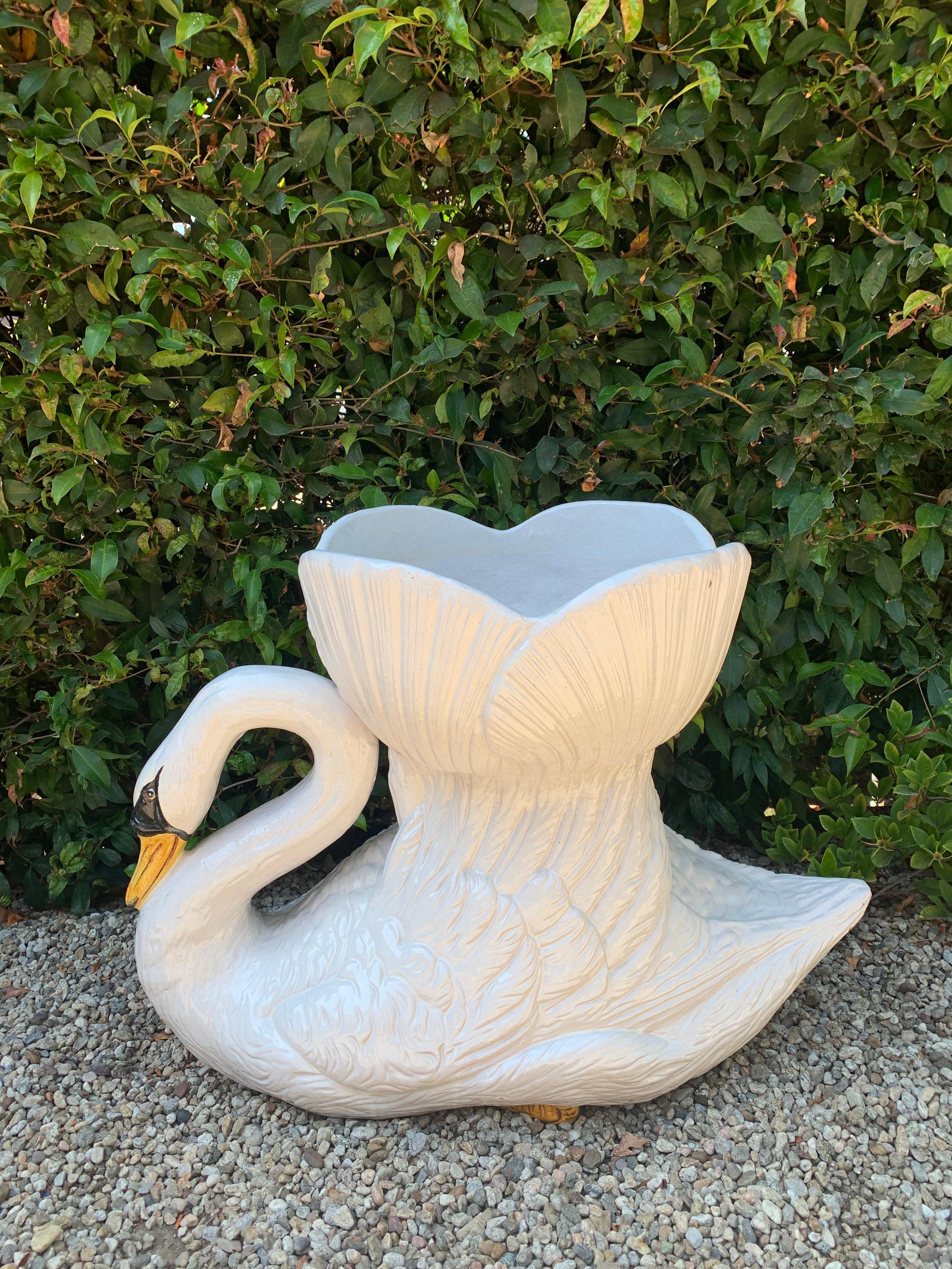 A monumental terra cotta swan from Italy. The piece is a wonderful addition to the garden or lanai. Made of dense material and able to withstand the elements. Works well as a centerpiece as well. The 15