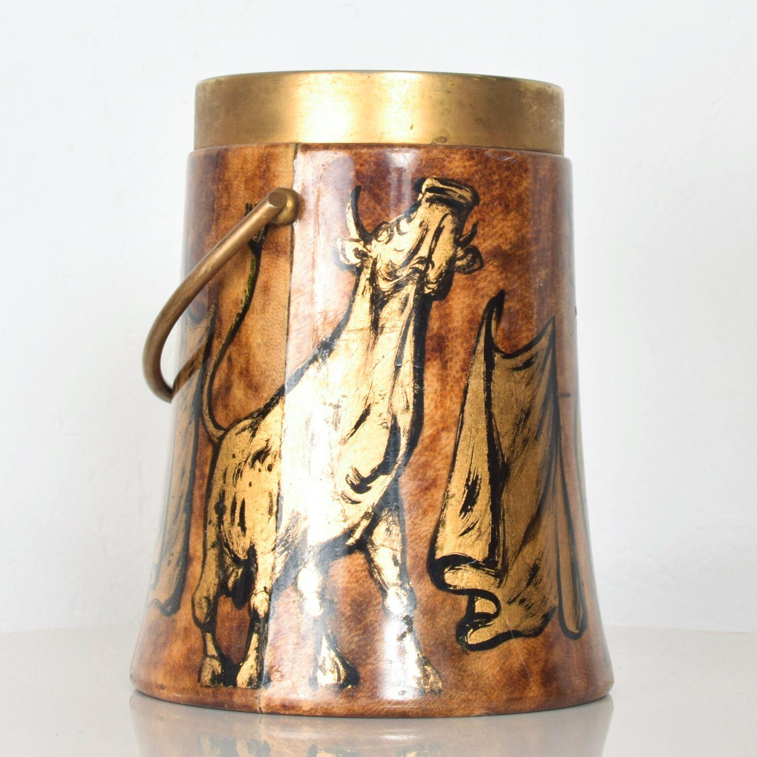 Rare ice bucket by Aldo Tura Macabo Cusano. Beautiful hand painted art, circa 1950s. ITALY
Fancy Gold Italian Stallion Bull Design. Made in Brass, leather and blown glass. 
Dimensions: 10