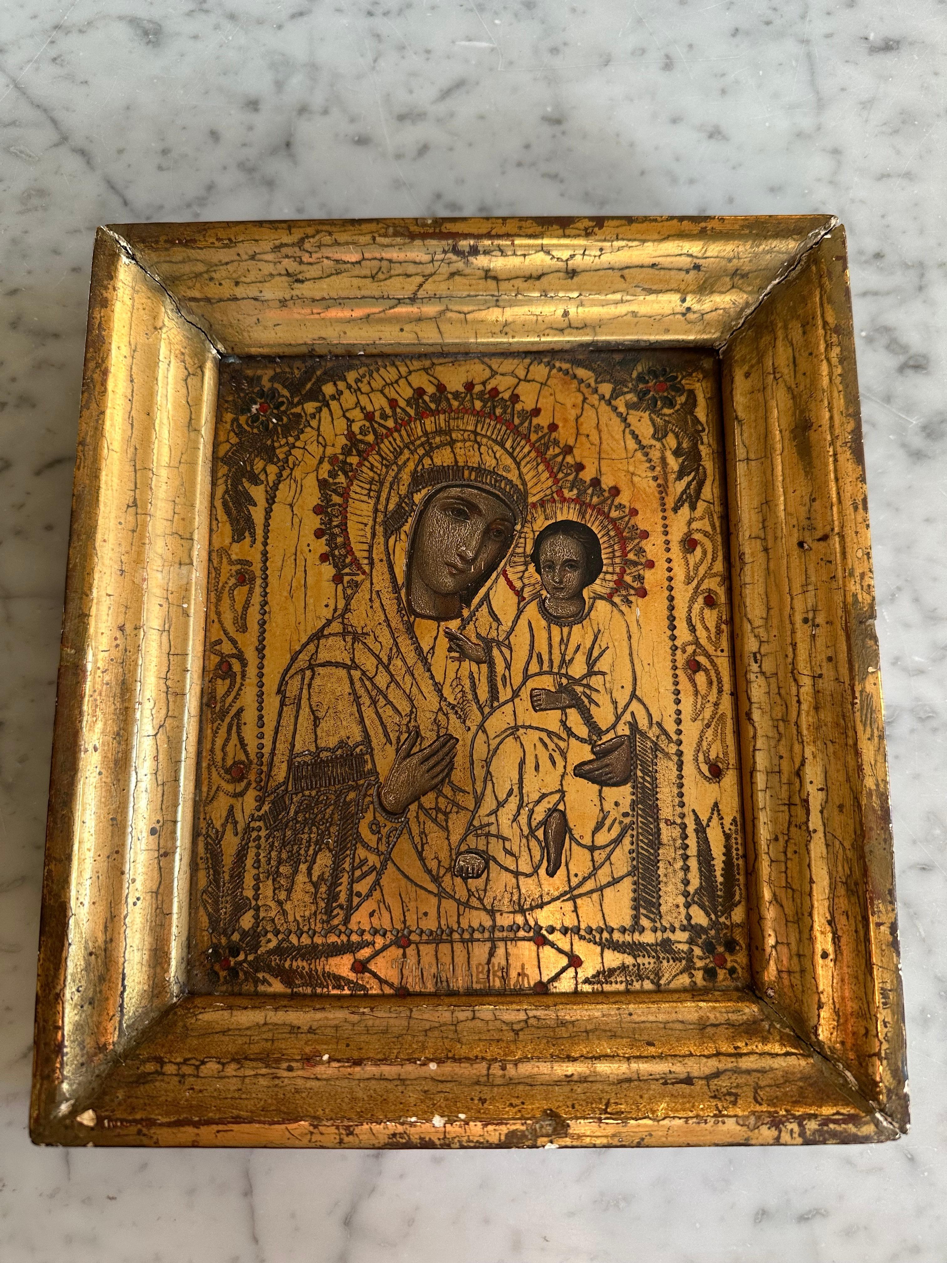 This stunning hand-painted icon from the mid-19th century is a remarkable example of religious art steeped in tradition and spiritual symbolism. Icons have long held a significant role in Orthodox Christianity, serving as windows to the divine and