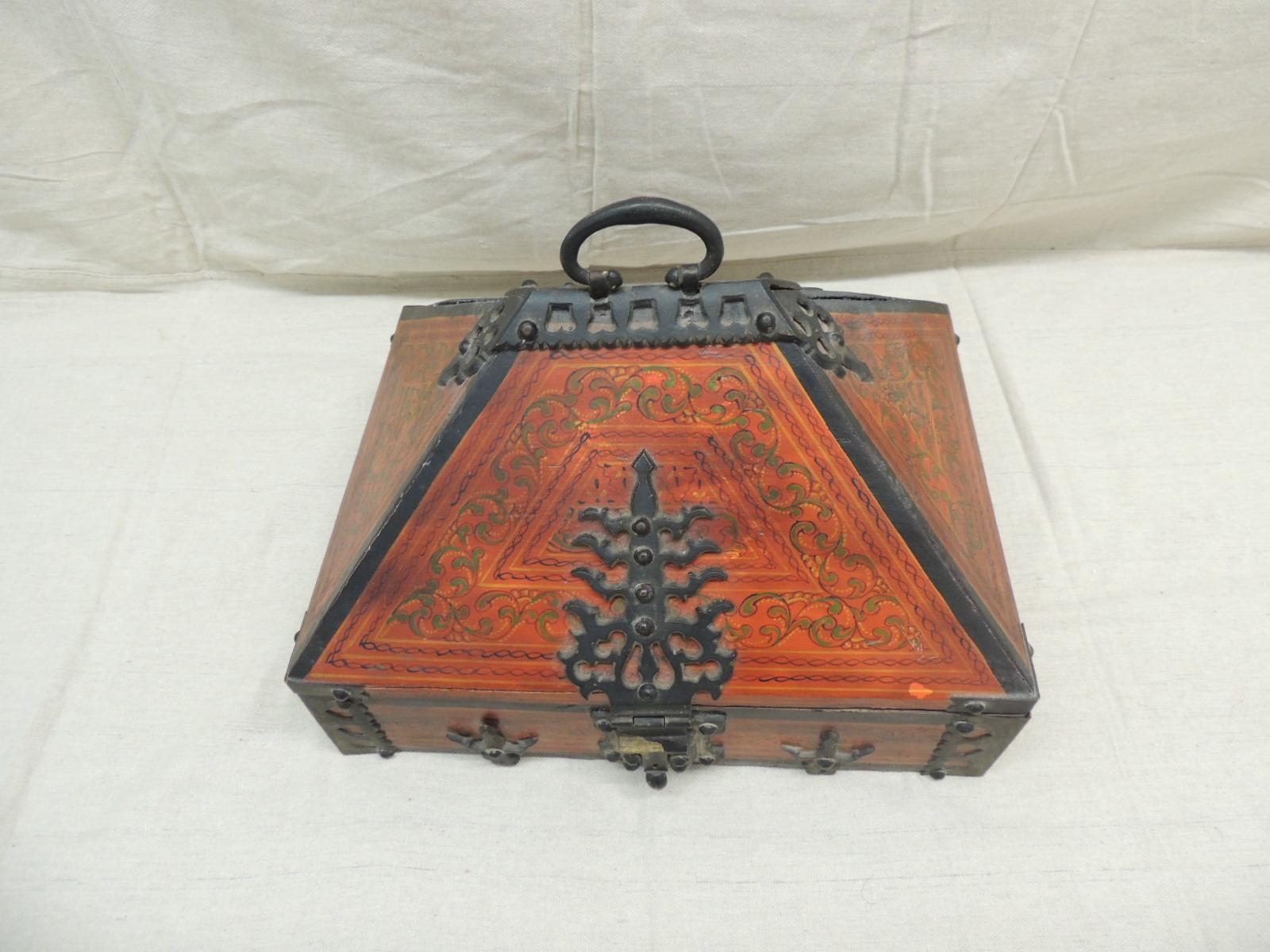 Hand painted Indian decorative box with hand forged iron details
Hidden compartment inside with conical shape top.
Karala - Nettur - Petti
Measures: 14” W x 10.5” D x 11” H.
        