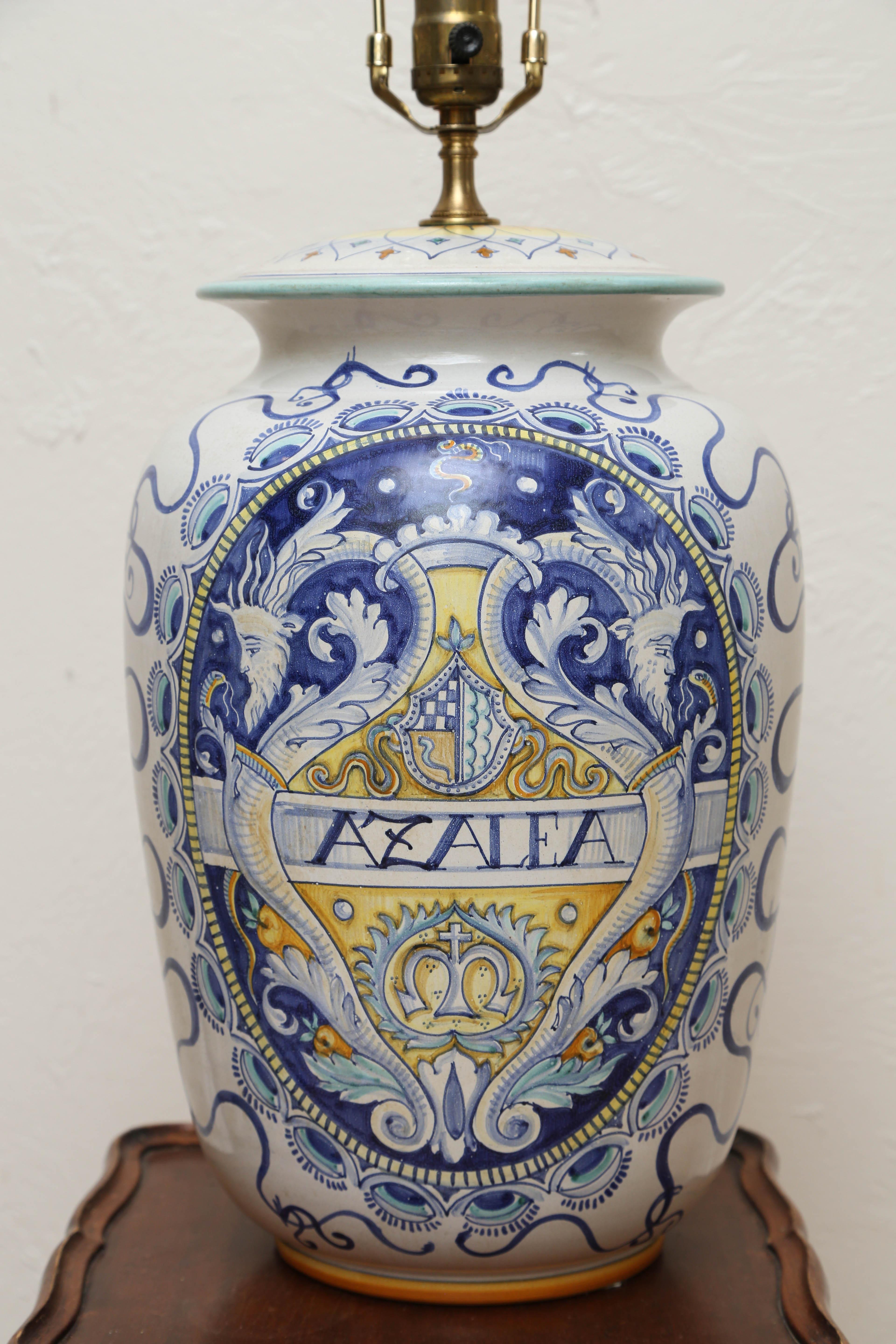 Hand painted armorial style lamp in blues and white with a touch of yellow.