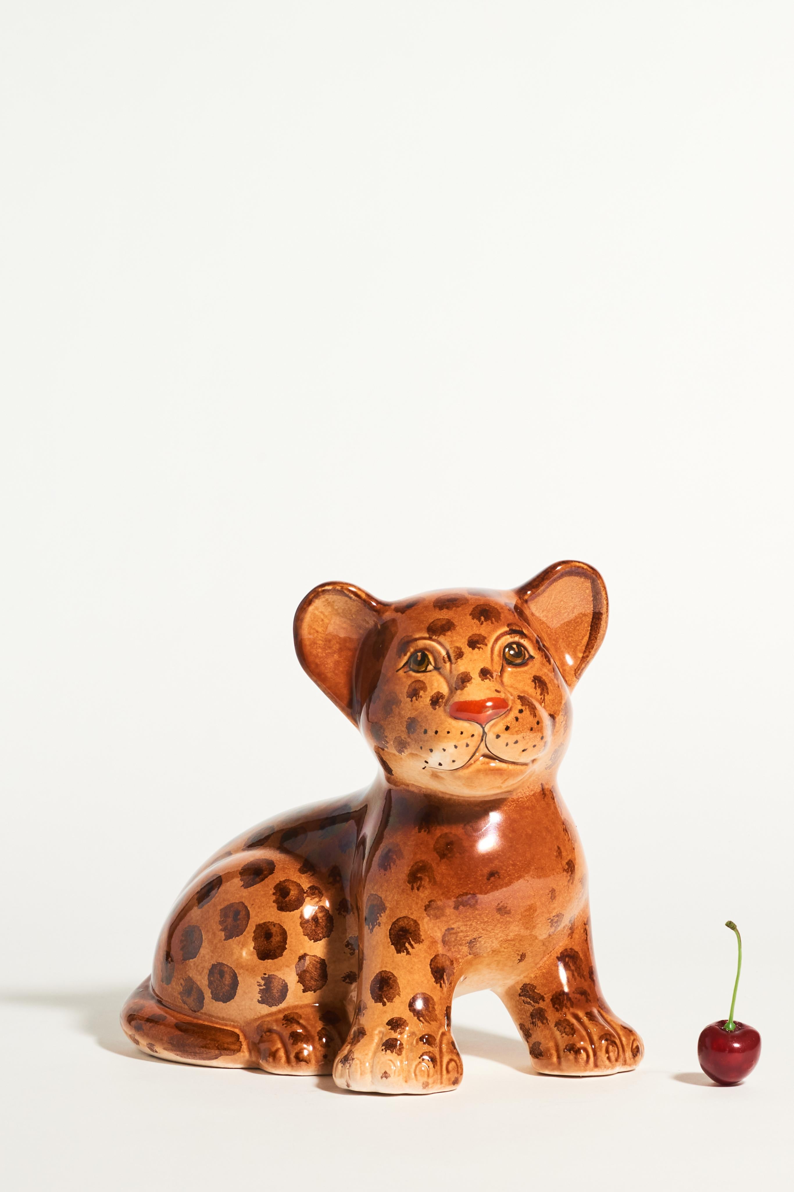 Italian ceramic hand painted leopard cub with sweet expressive face and lovely warm glazed colors.