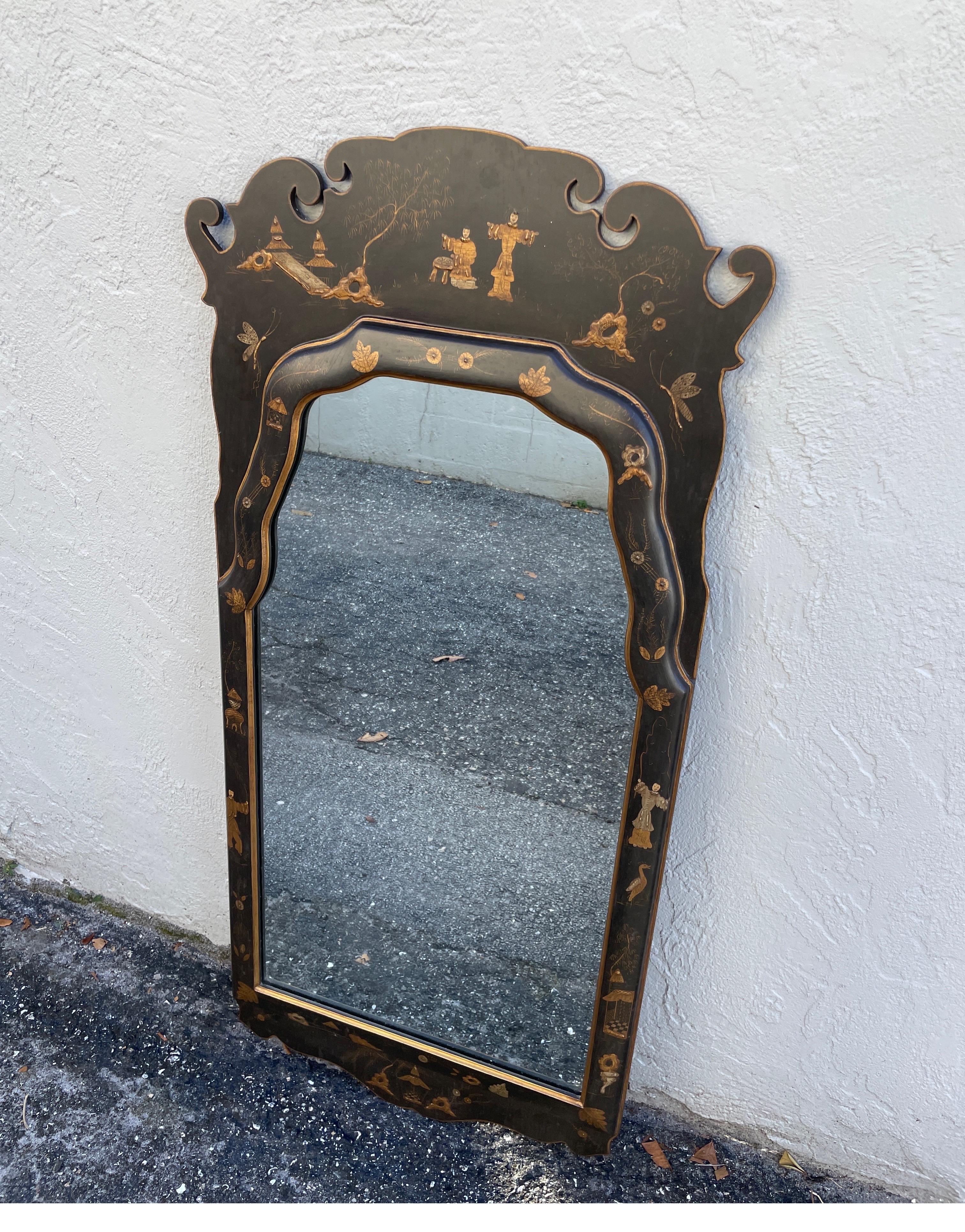Vintage hand painted black and gold chinoiserie mirror.