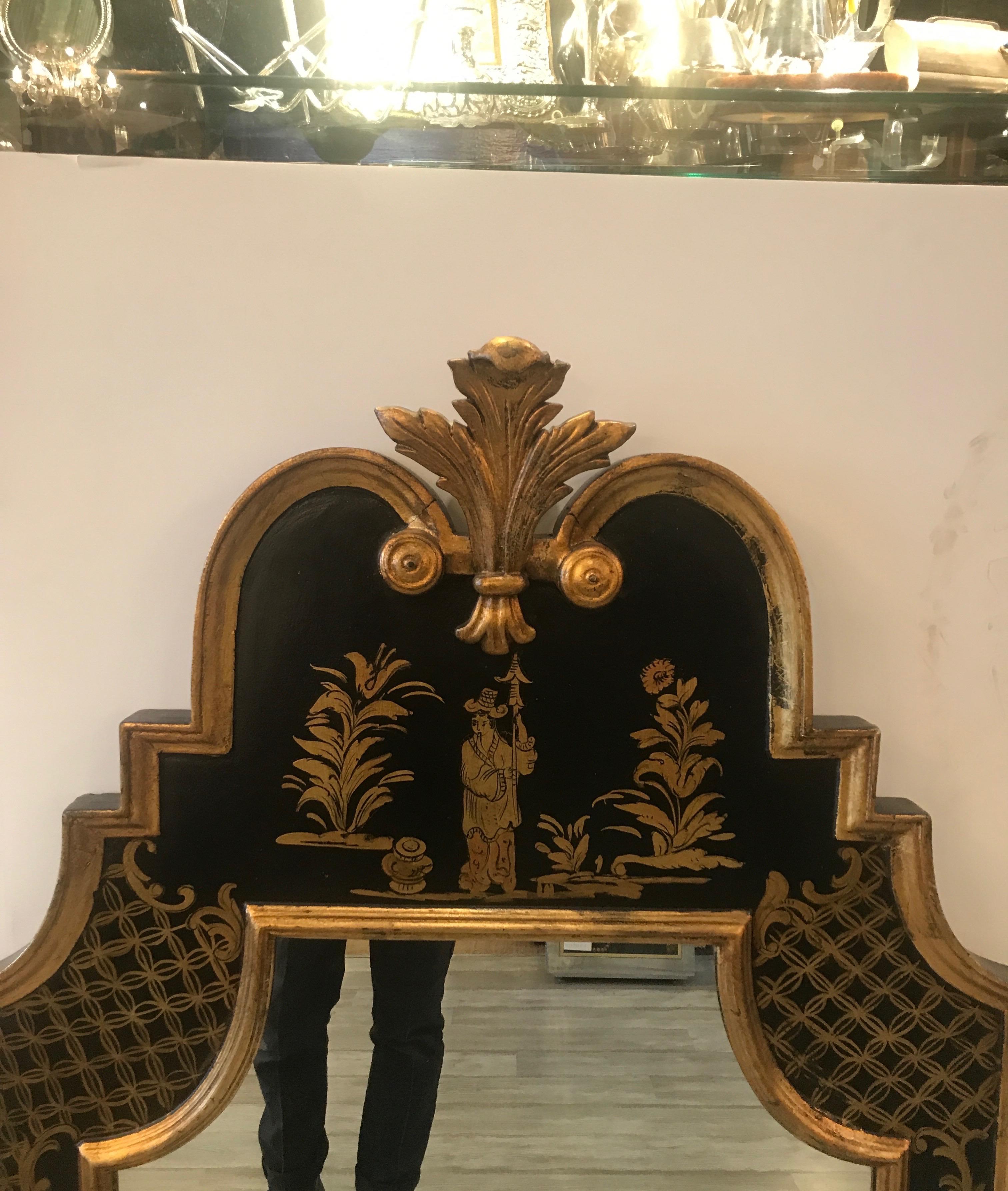 Elegant Italian Chinoiserie and gilt mirror. The elaborate pediment top with plume finial with a back frame with hand painted gilt decoration.