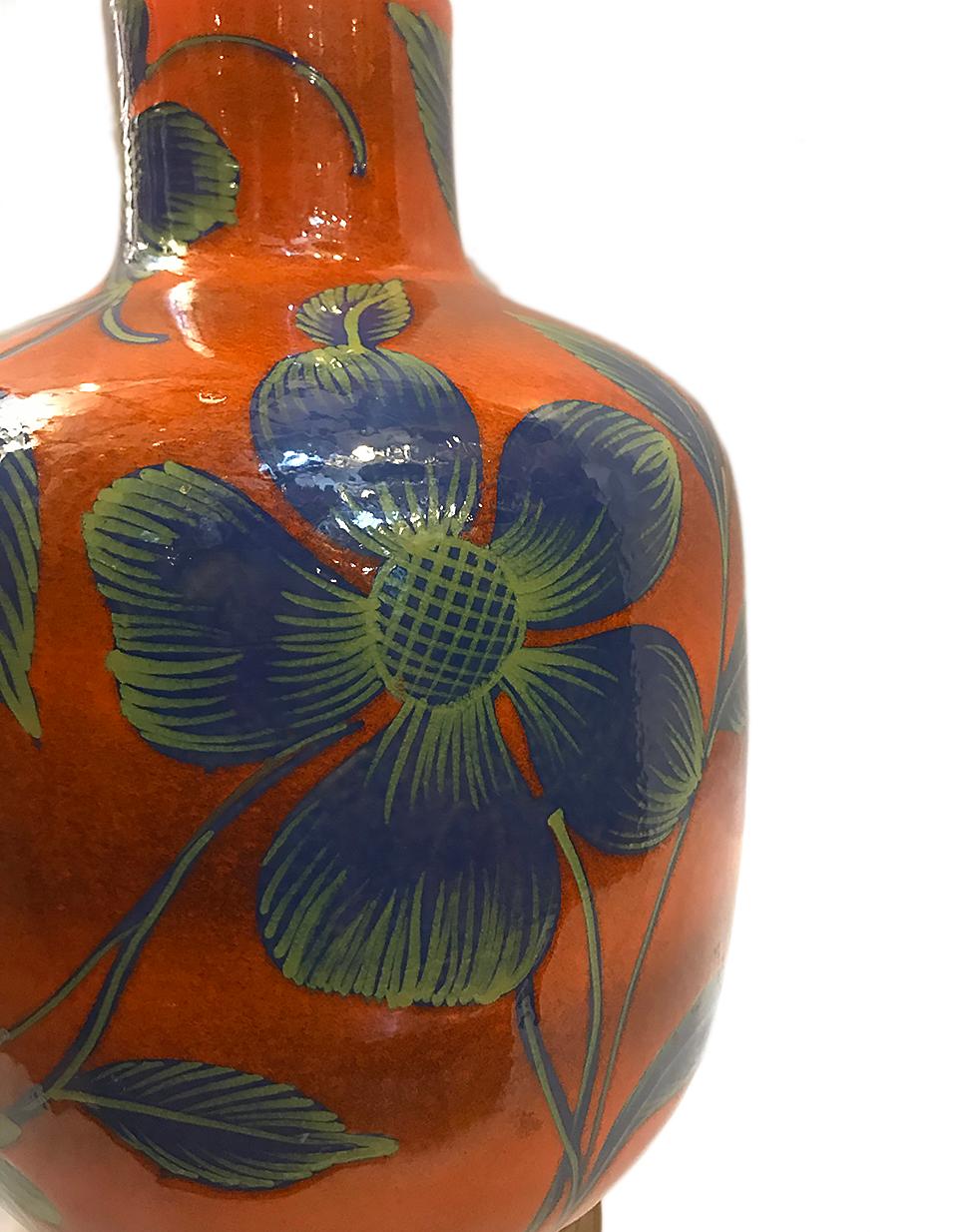 Italian hand painted and glazed porcelain lamp with oversized blue flowers on a burnt orange background, circa 1960s.
Measurements:
Height of body:  18.75
