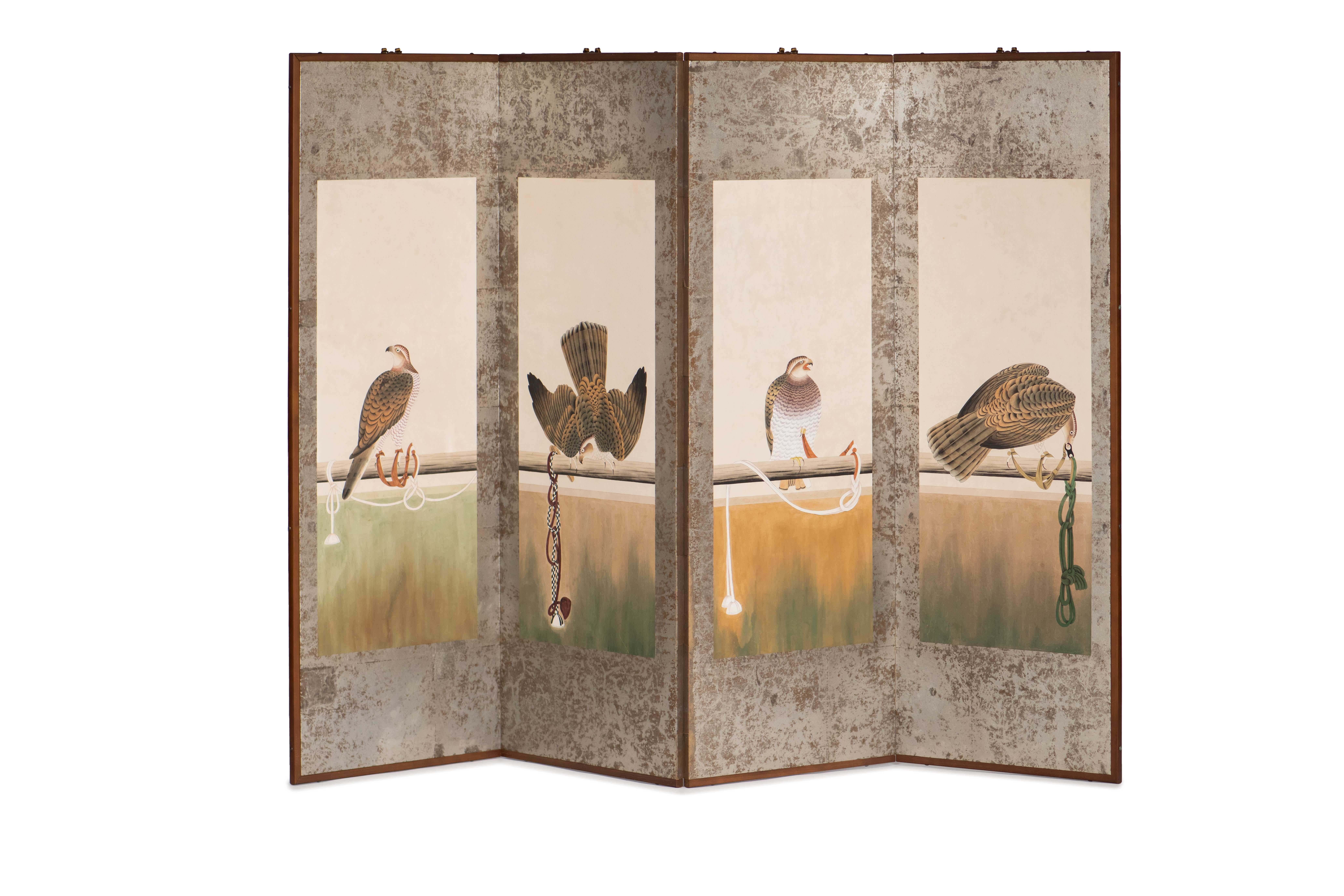 The hawks painting of this four-panel screen is hand-painted in watercolor, on squares of silver leaf which are applied by hand to the paper base over carefully jointed wooden lattice frames. Lacquer rails are then applied to the perimeter to finish
