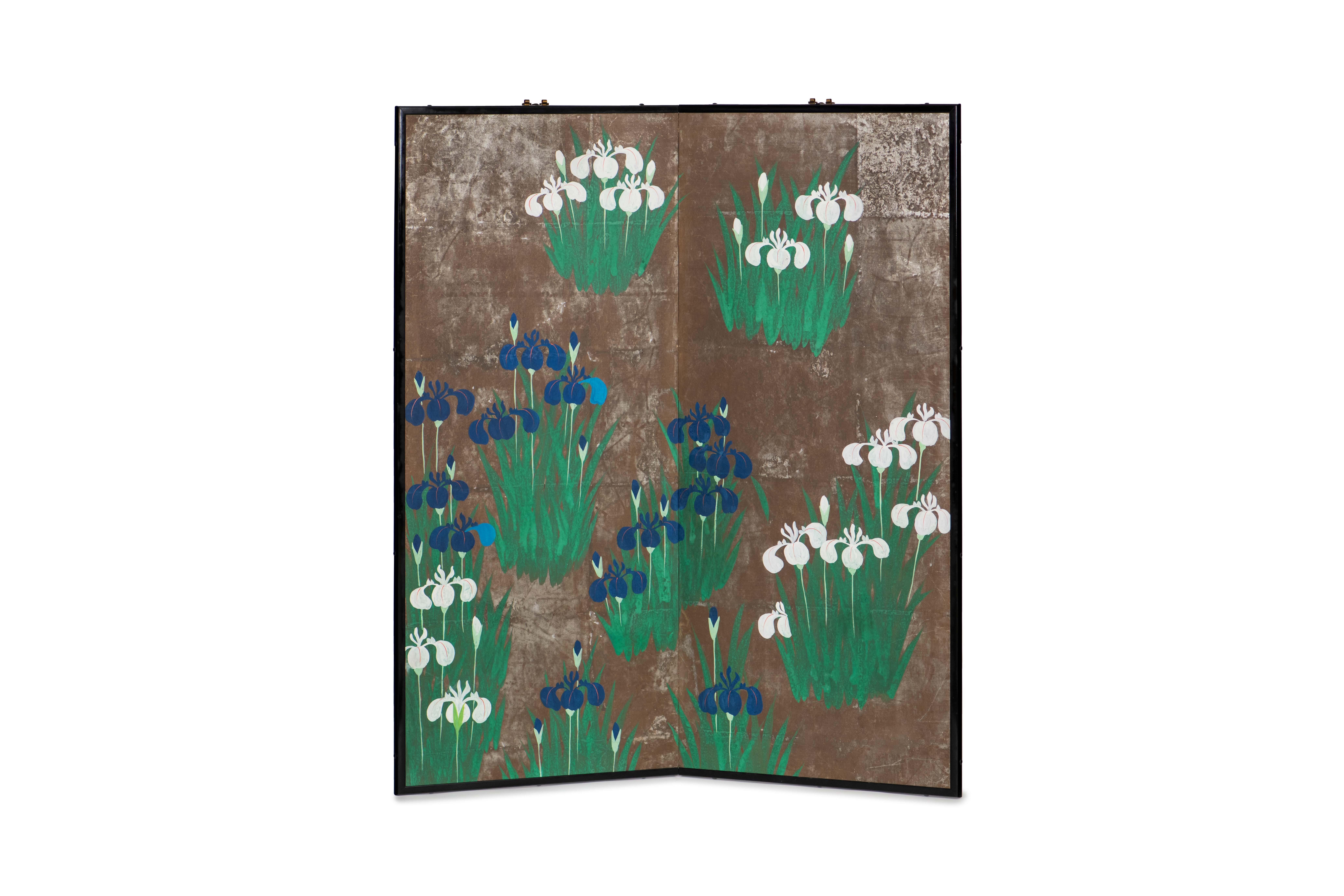 The irises painting of this two-panel screen is hand-painted in watercolor, on squares of silver leaf which are applied by hand to the paper base over carefully jointed wooden lattice frames. Lacquer rails are then applied to the perimeter to finish