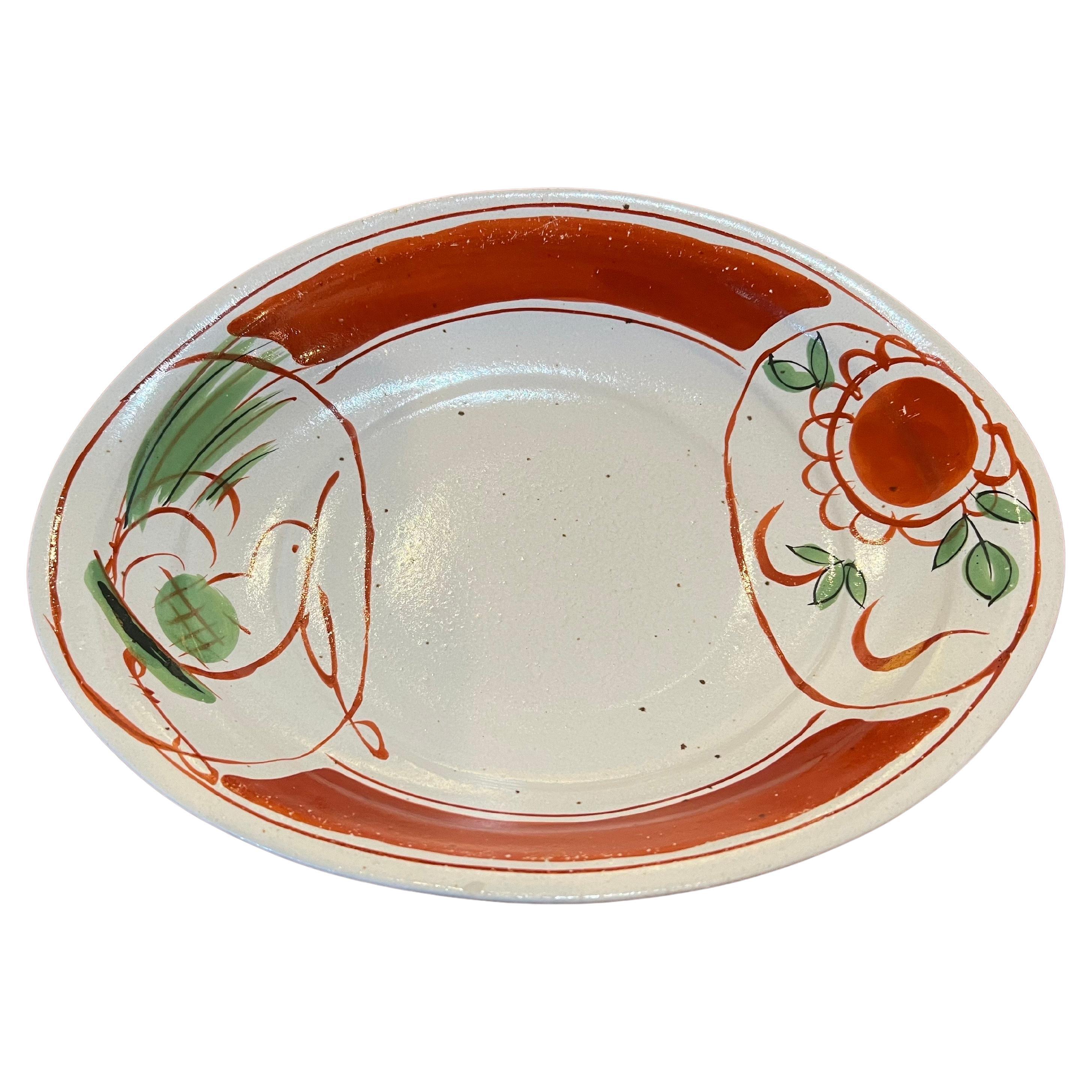A rare curved bowl plate with raised edges , circa 1980's from Japans Sanyo Pottery , beautiful elegant a great piece on collectible Japans pottery. Stamped at the bottom.