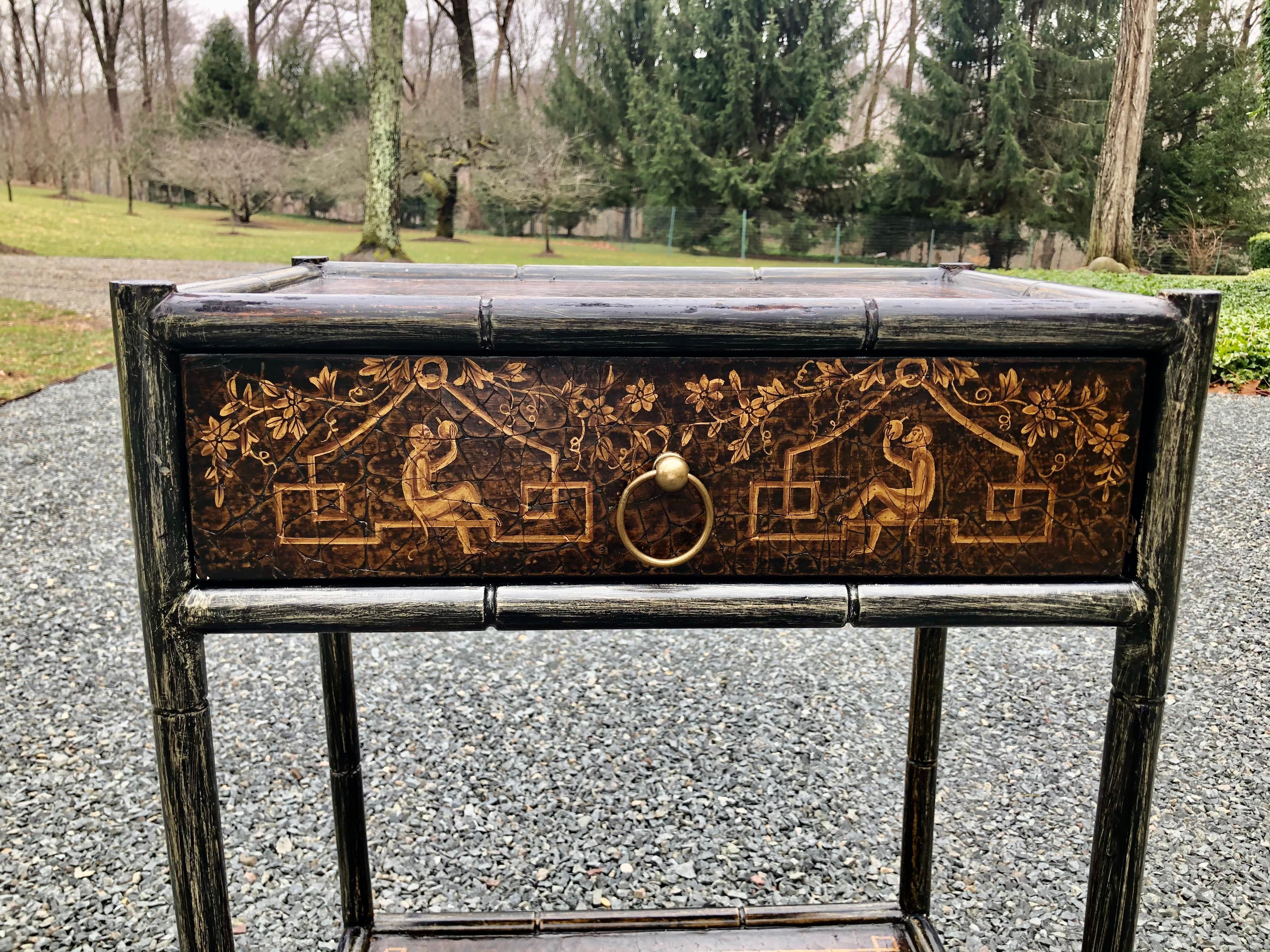 Hand painted and leather end table or night stand having distressed black background and marvelous paintings of a monkey holding a piece of fruit on the single drawer, and lovely trellis design on sides and back. The leather is embossed in an