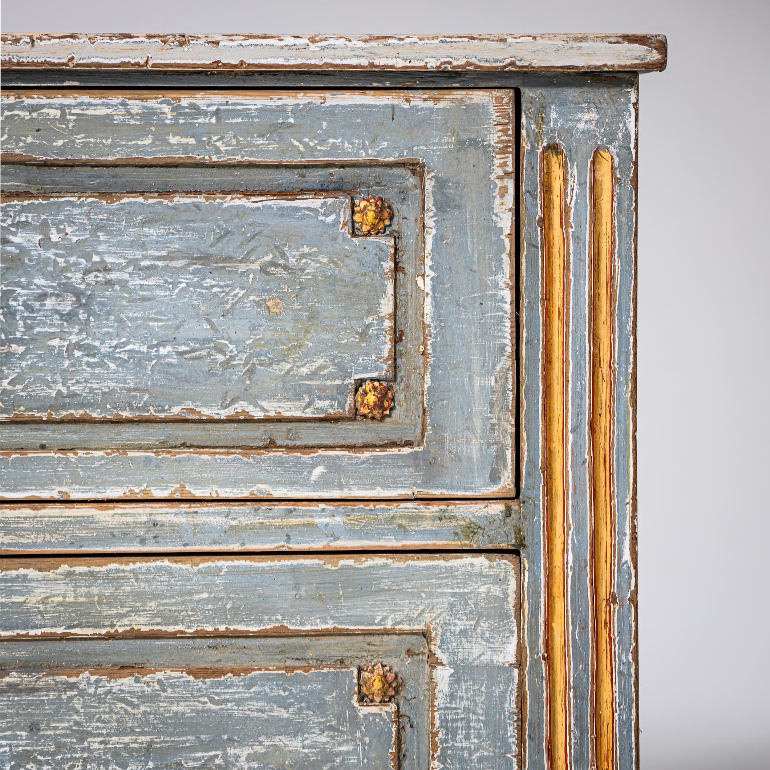 Hand-painted Louis XVI chest of drawers with two drawers and tapered legs. Finished in light blue with gilded accents. The paintwork is newly executed, inspired by historical models.