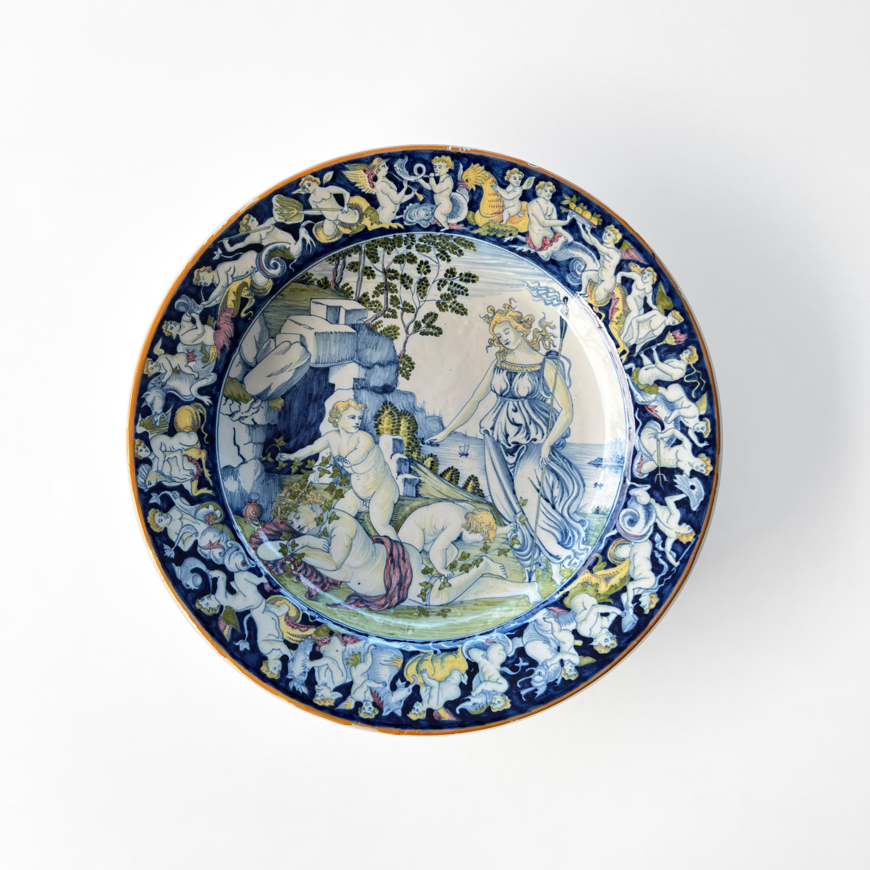This beautiful platter in hand painted majolica is a copy of an important piece by renowned Renaissance artist Jacopo Schiavon, from the Tuscan town of Cafaggiolo. 
The original is in the collection of the Fundação Calouste Gulbenkian in Lisbon,