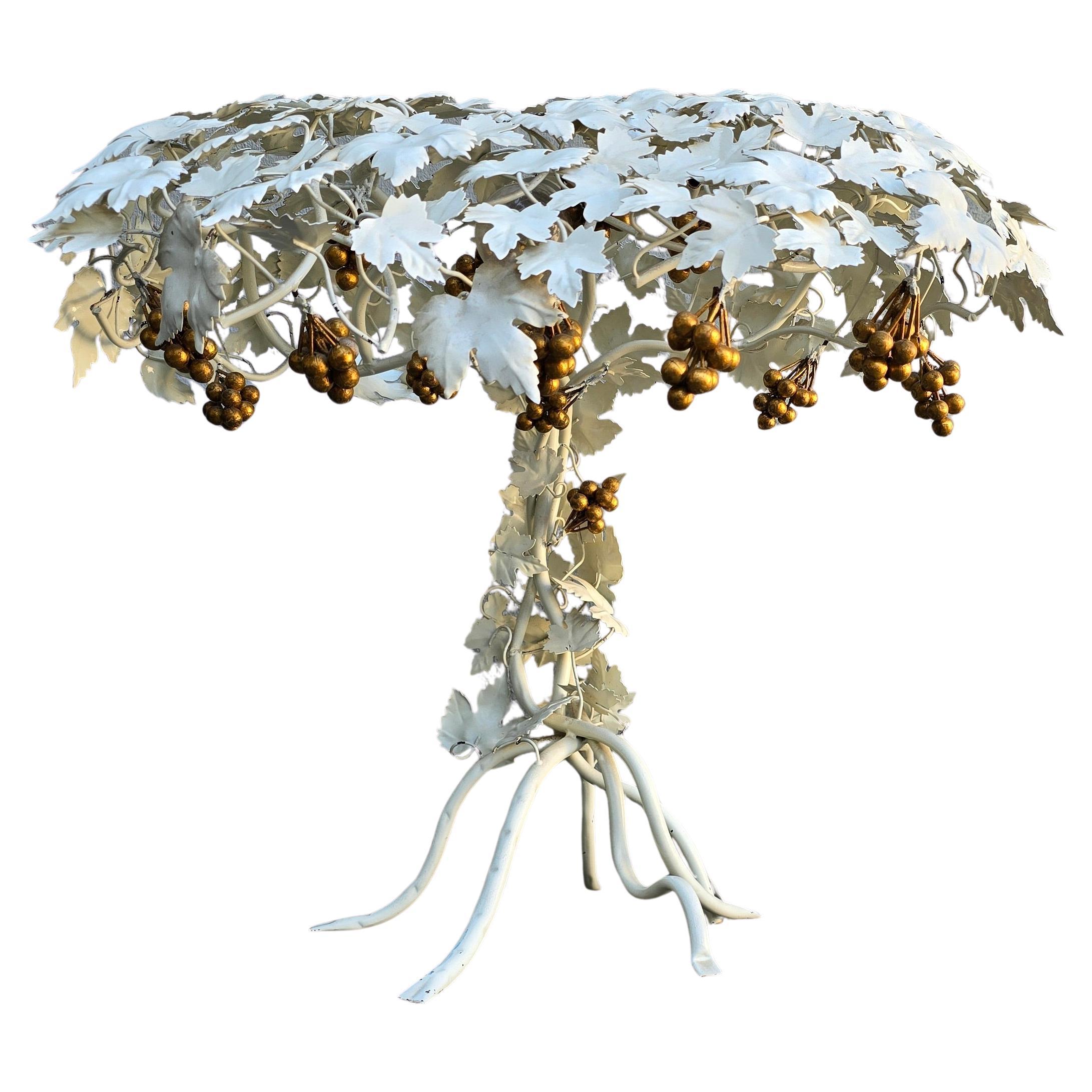 Hand-Painted Metal Grapevine Table Lamp in Hollywood Regency / Art Nouveau Style

This striking table lamp is a sculptural lighting piece that blends natural elegance with vintage glamour. Crafted from metal and meticulously hand-painted in soft