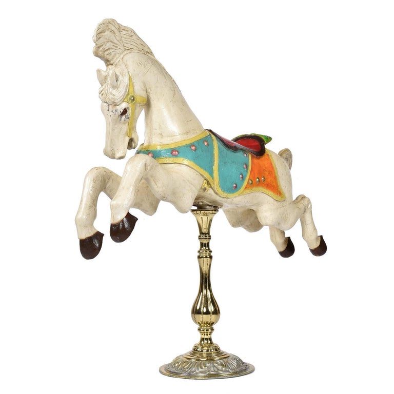 Horse is embossed with the makers mark on one of its hooves. Made by Charles Looff and stamped C.W. Parker. 

Perfectly captured in all it’s glory, this vintage carousel horse is sure to gallop your heart. One look at this radiant mare, and you’ll