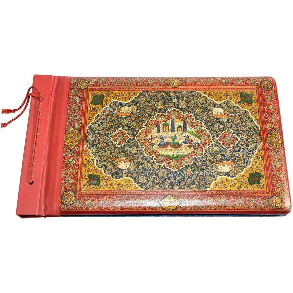 Antique Middle Eastern Qajar style Moorish picture photo album, with hand painted miniatures on the cover.
This fine Middle Eastern Moorish style scrapbook is hand painted with 22-karat gold, with wonderful landscape scenes with figures, elaborate