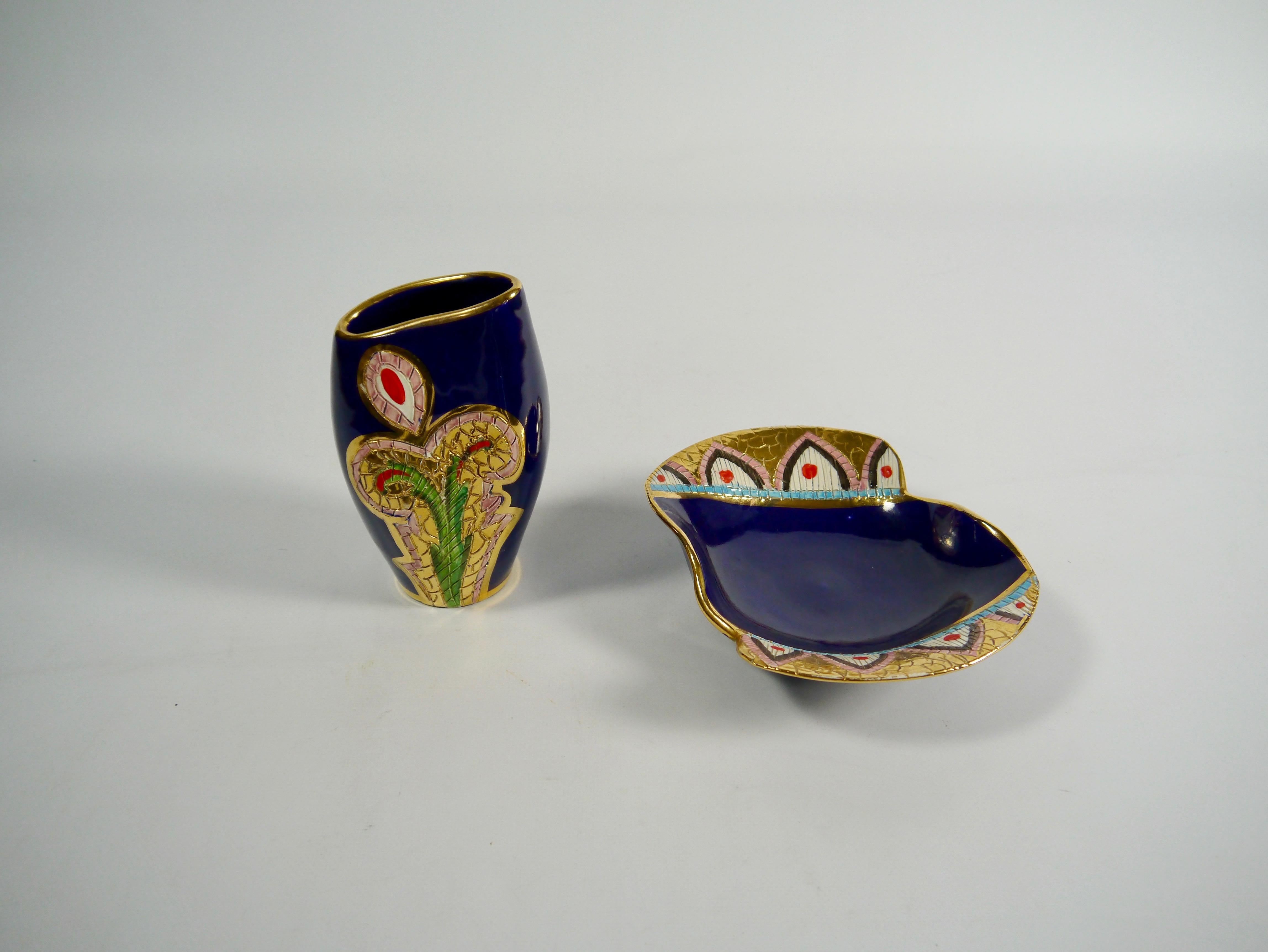 Two charming 1950s midnight blue porcelain vessels, made by the Italian porcelain studio Fiamma from Sesto Florentino, Italy. Hand painted pattern in gold, green and red. Marked with makers mark and 2339 resp. 2342, 