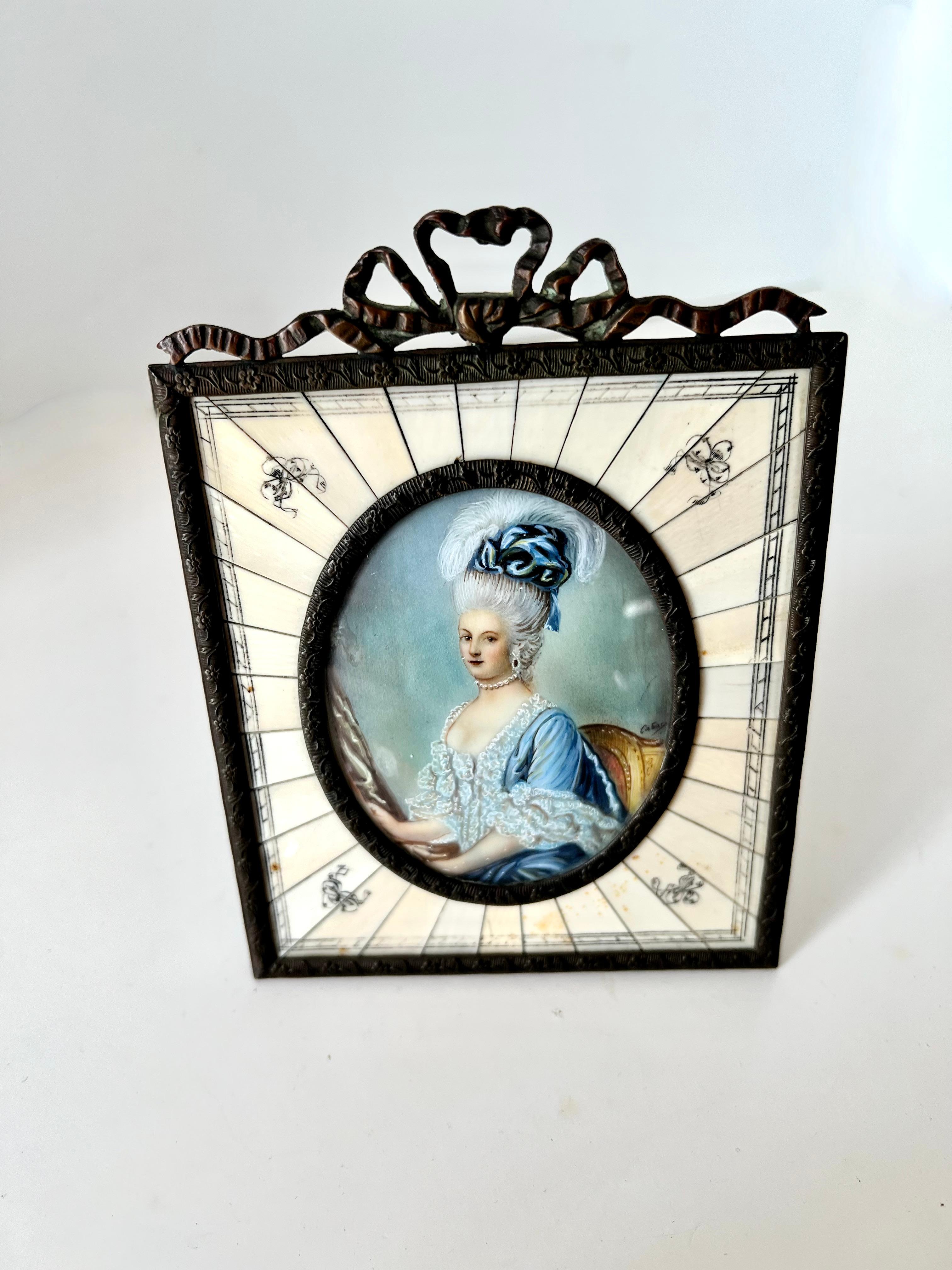 A late 19th Century hand painted mature portrait in a bone and Bronze frame with velvet backing and bronze twig like stand.  An impeccable piece and lovely on the desk or shelf.

A well crafted piece, hand made and attention to all details.  A