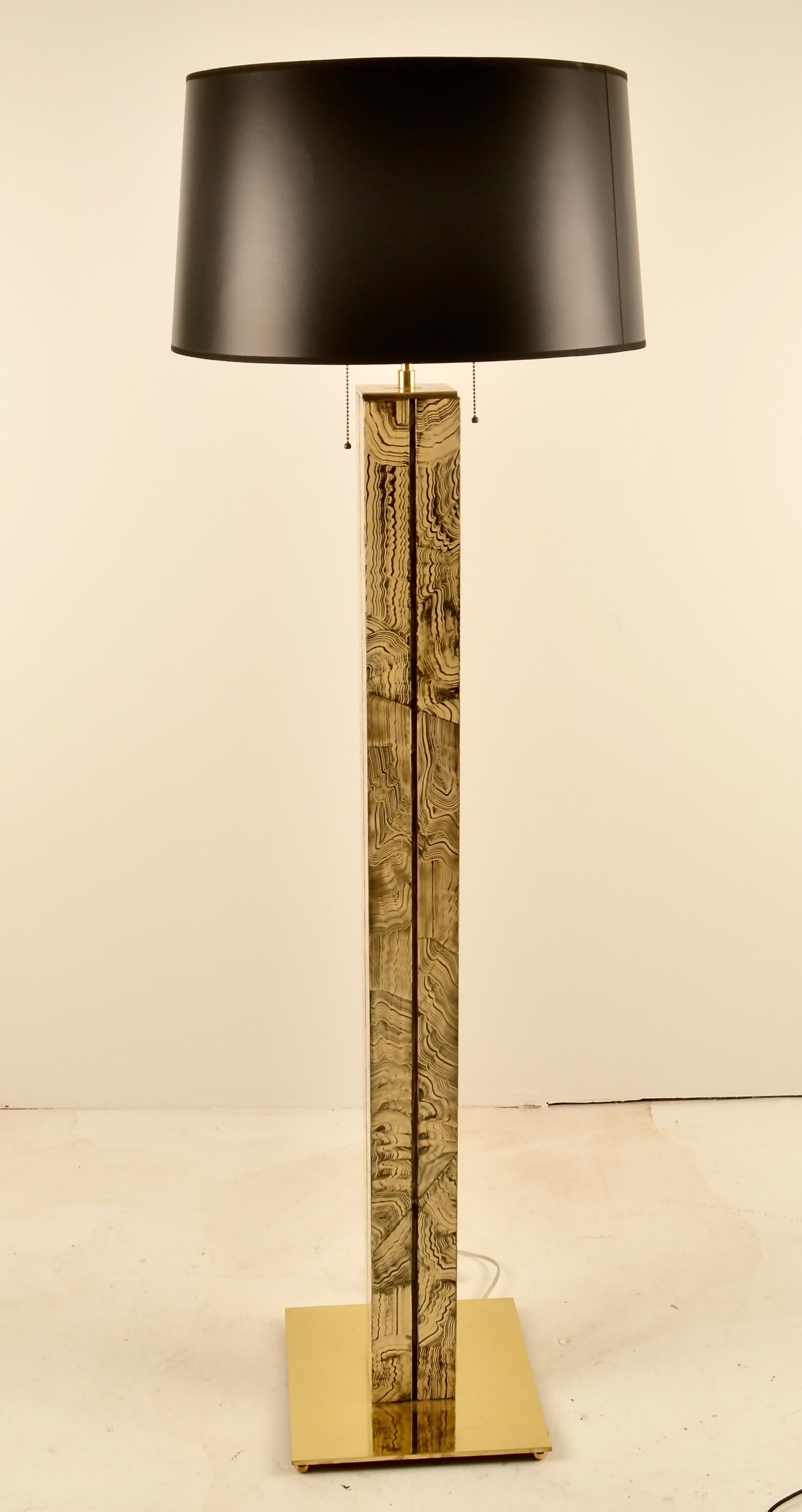 Dramatically hand painted floor lamp with solid brass base and lamp fittings. All new wiring and new shade. Brass fittings have been newly polished and lacquered. The lamp measures 12' X 12' at the base and is 62.25