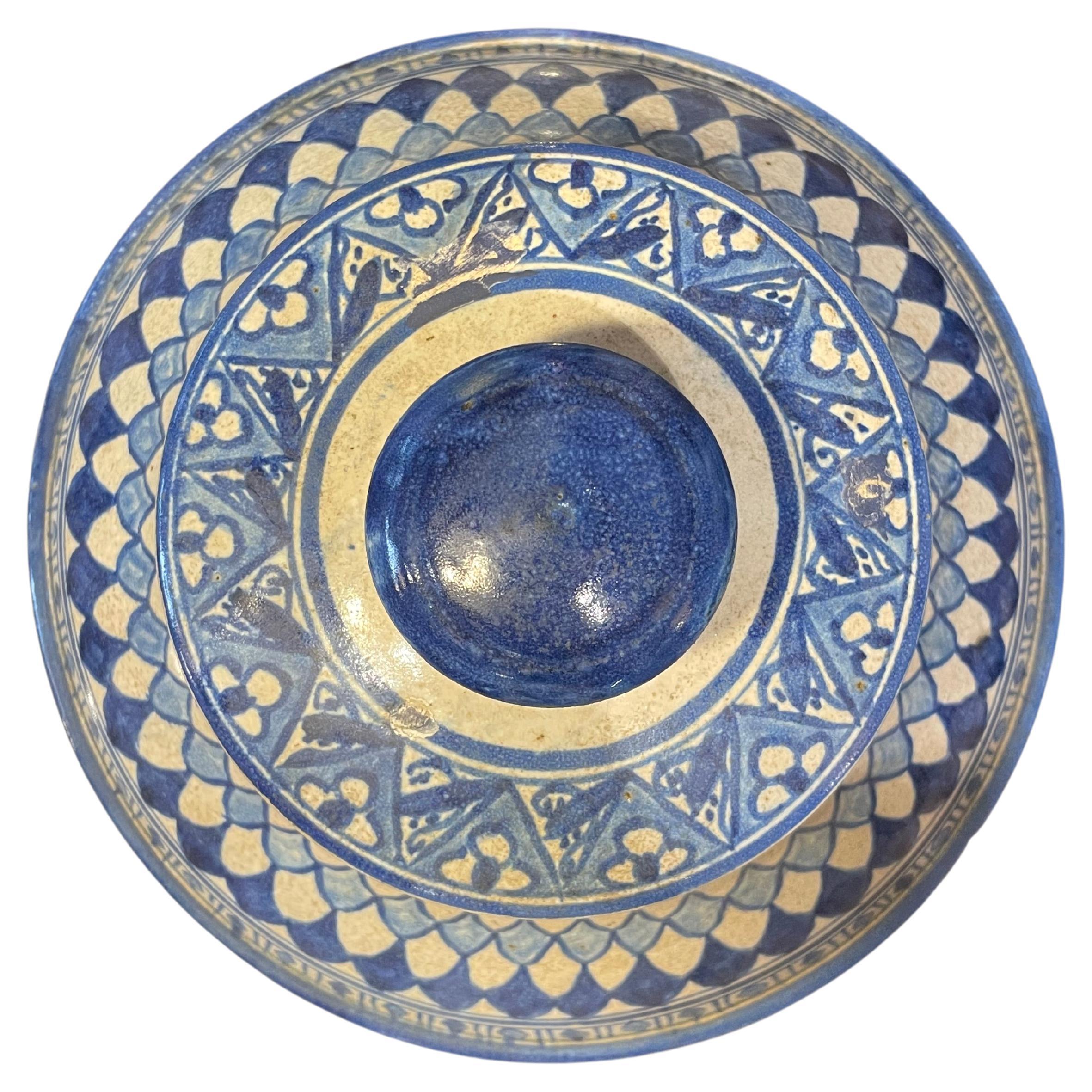 Vintage ceramic Moroccan covered dish. 
Hand-painted with three colors of blue paint on an ivory glazed finish. Circa 1940