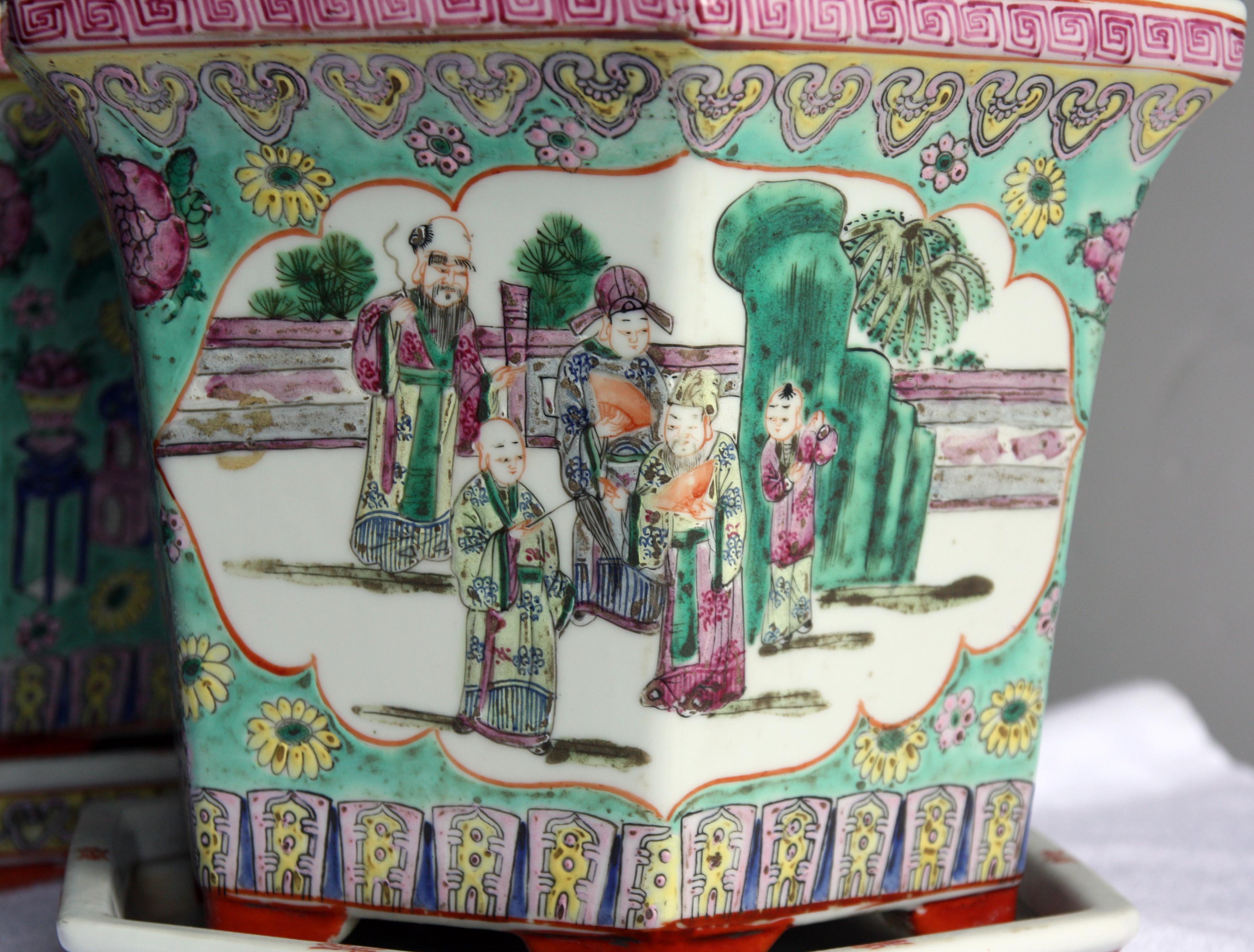 Lovely pair of hand-painted Chinese porcelain cachepot or jardinières with saucers.
