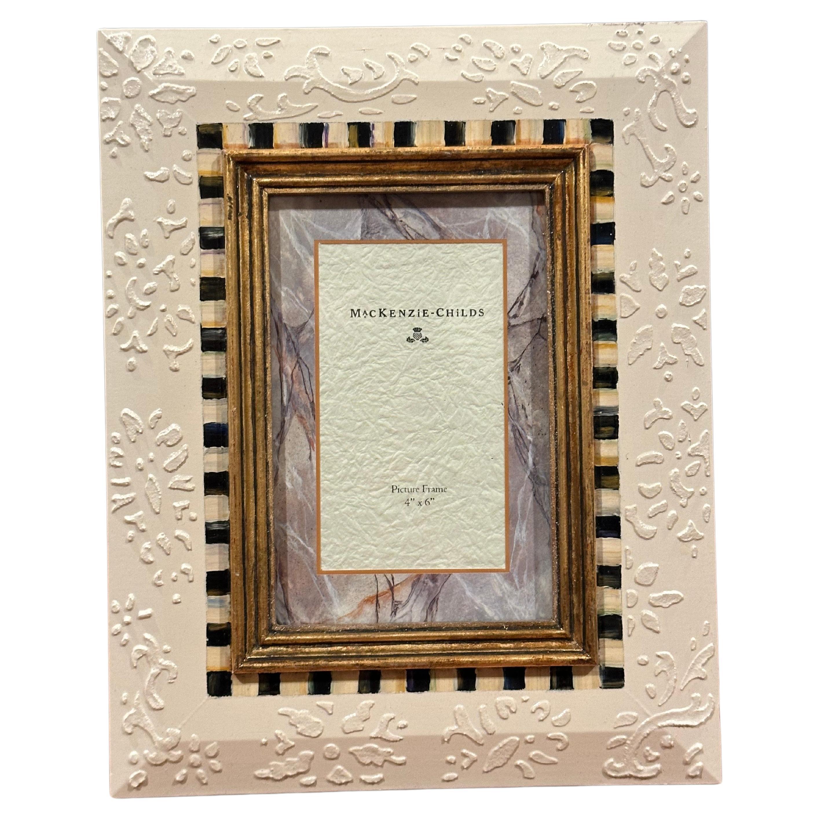 A nice hand painted picture frame by MacKenzie Childs, circa 1990s. The frame is in new unused condition and is for a 4