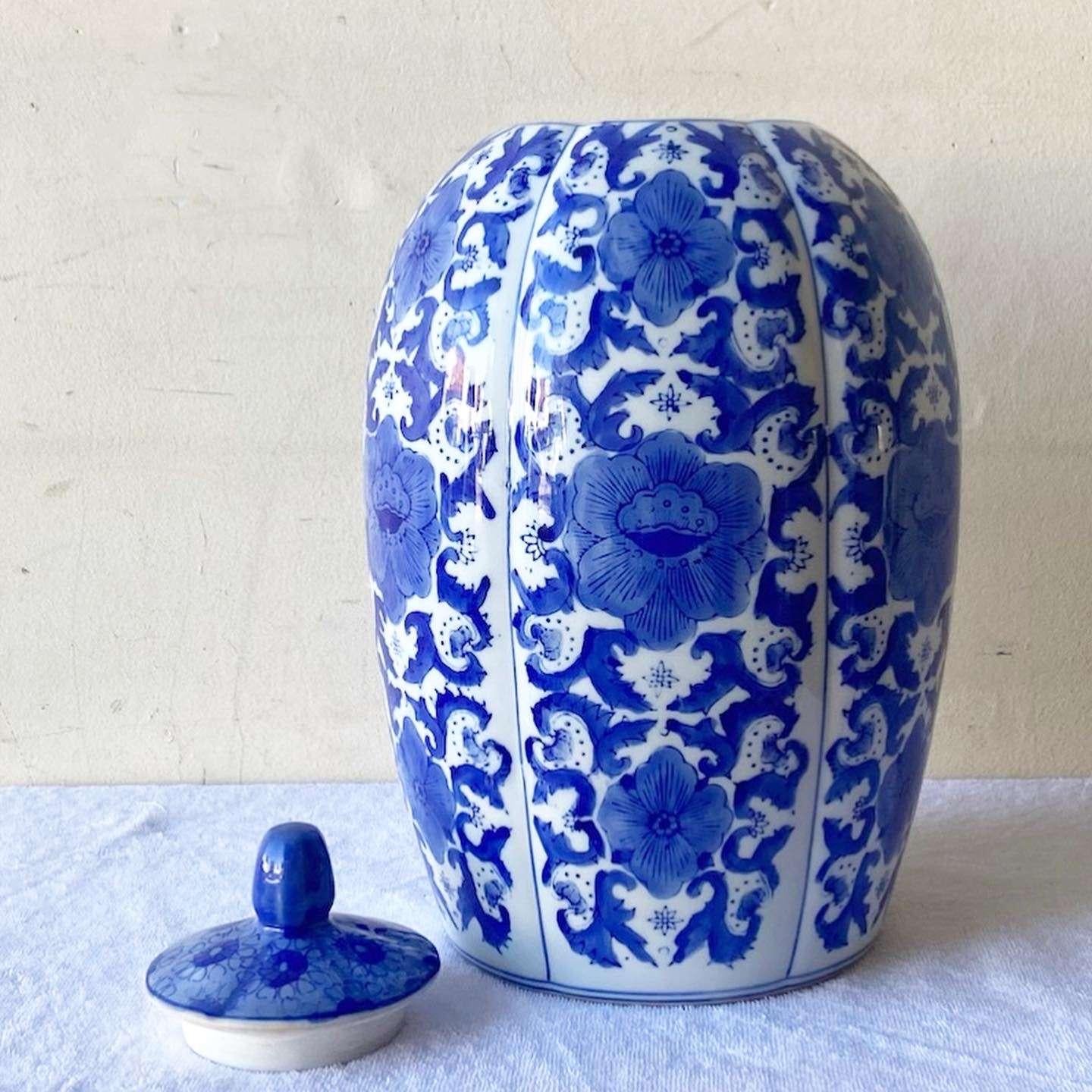 Exceptional vintage Chinese blue and white ginger jar. Features an ornate hand painted floral design throughout the jar.
