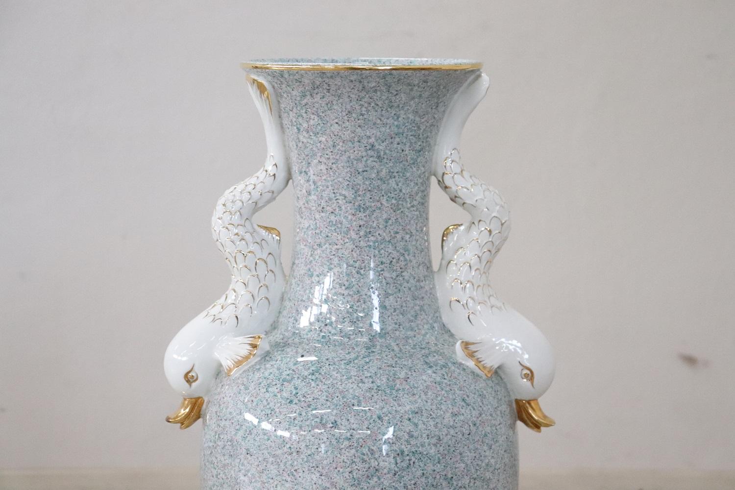 Beautiful fine porcelain Italian vase, 1980s. Beautiful decoration with two dolphins on either side.