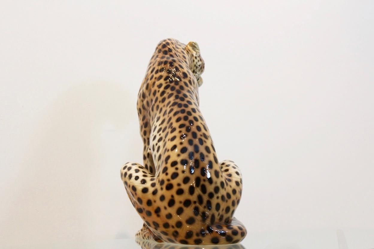 A stunning and rare hand-painted porcelain leopard by Ronzan Torino, Italy. Giovanni Ronzan and his brothers founded the Ronzan factory circa 1940s shortly after he had left his job as chief painter and ceramic modeller at the Lenci factory. This