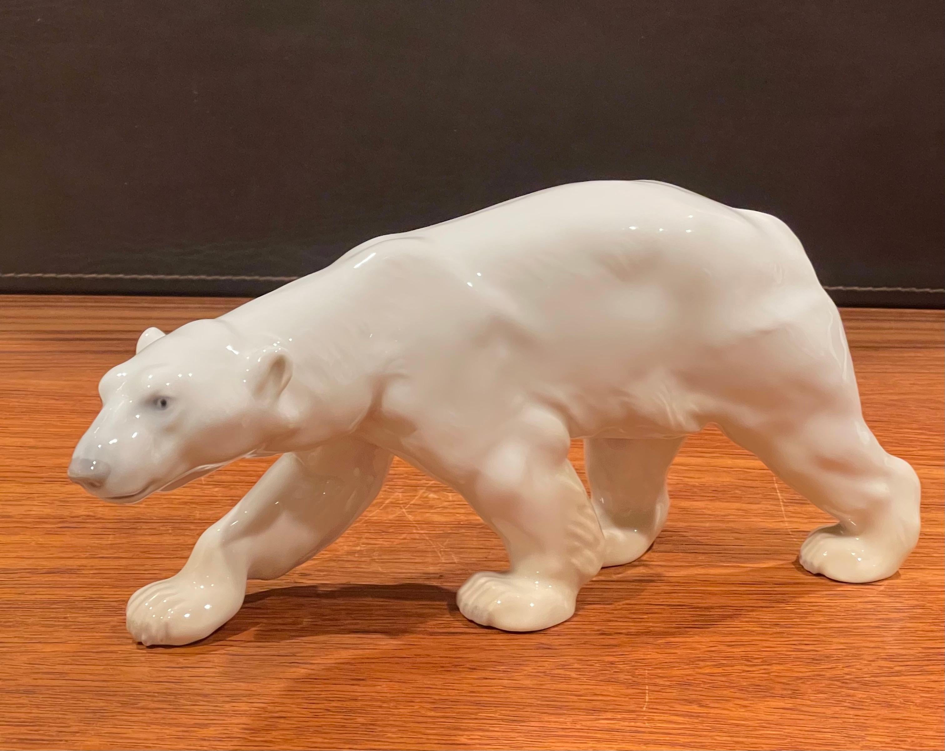 A very nice hand painted porcelain polar bear sculpture by Bing & Grondahl of Denmark, circa 1970s. The piece is in very good vintage condition with no chips or crcks and measures a substantial 12