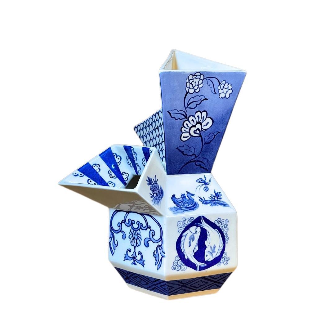 This stunning hand painted porcelain tulip vase is not only a one-of-a-kind work of art, but also a testament to the talent and diversity of both artists behind it. Designed by architect Nilüfer Kozikoglu and painted by a porcelain artist Sera Ilel,