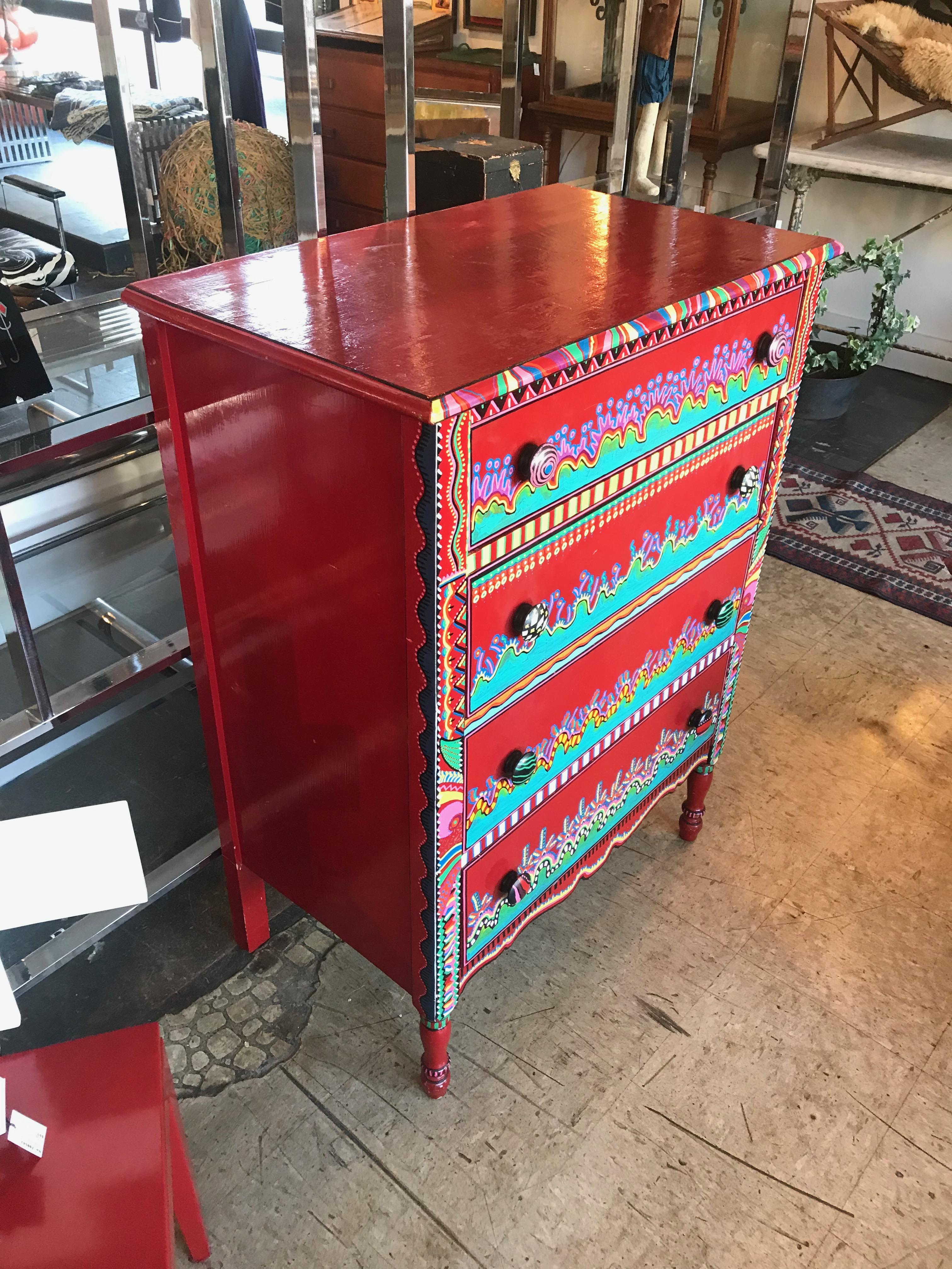 This is a late 20th century wildly colorful hand painted Memphis style 4-drawer dresser.