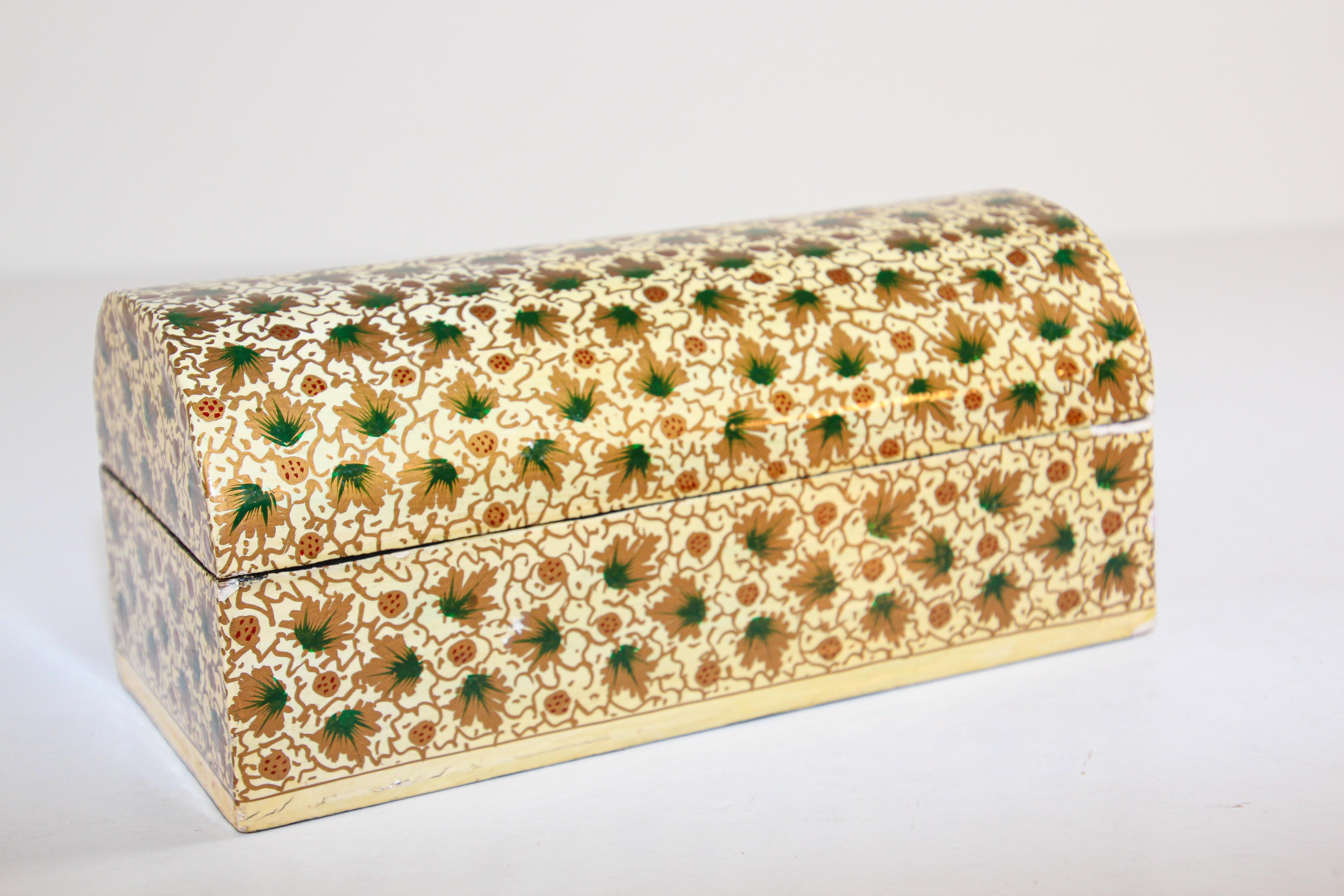 Hand painted Rajasthani Moorish papier mache lacquered box in rectangular shape with dome lid decorated with floral designs in green and gold on ivory color background, interior is black.
Great decorative Indo Persian style papier mache lacquer